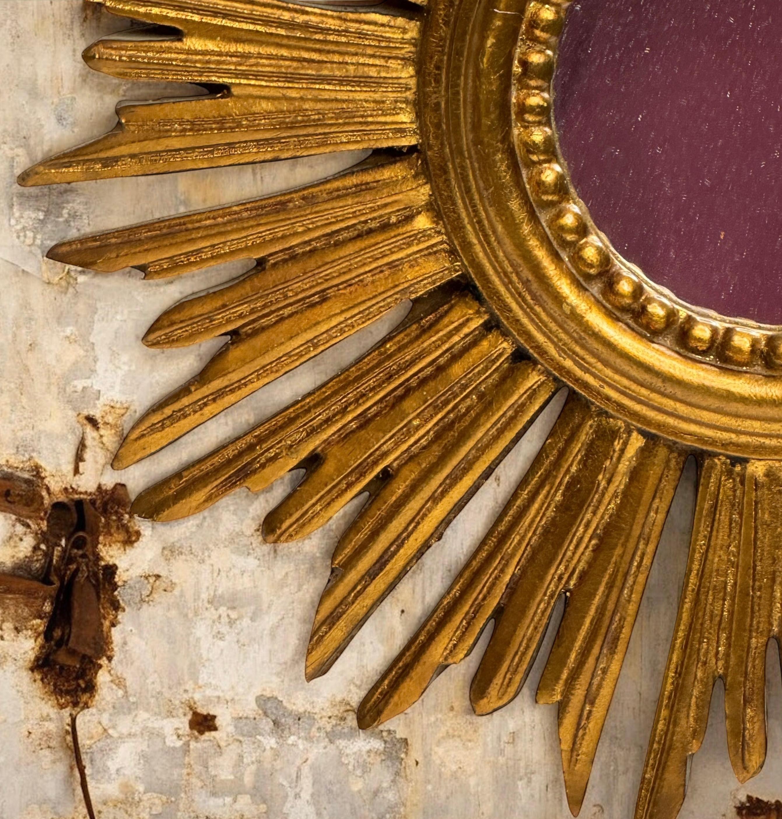 Hollywood Regency Petite Starburst Sunburst Gilded Wood Mirror, Germany circa 1950s For Sale