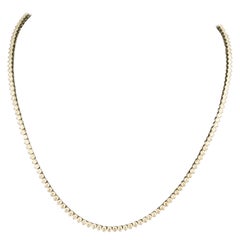 Pequeño collar de diamantes de línea recta en oro blanco