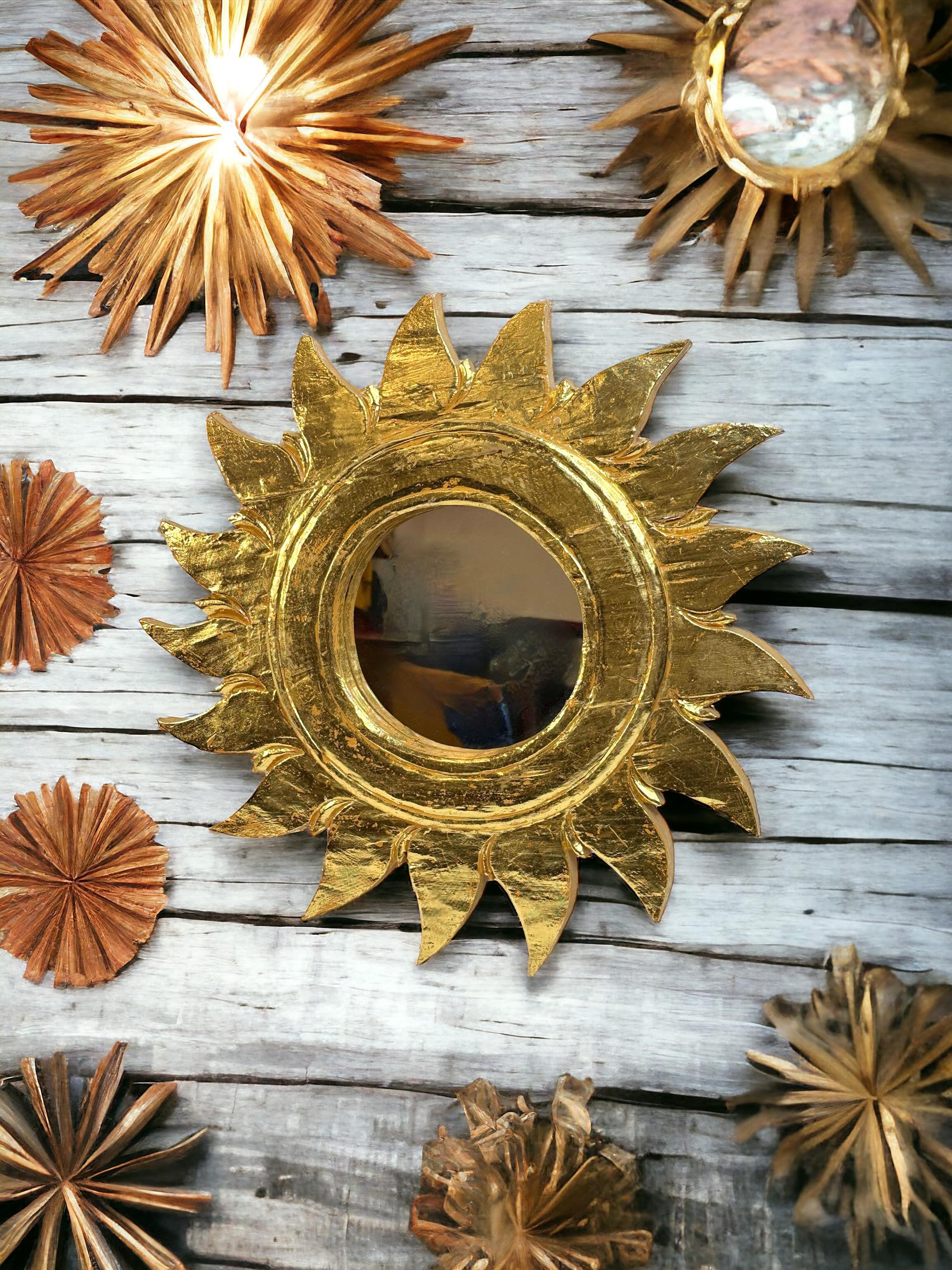 A gorgeous starburst sunburst mirror. Made of gilded wood and composition. It measures approximate: 19.5