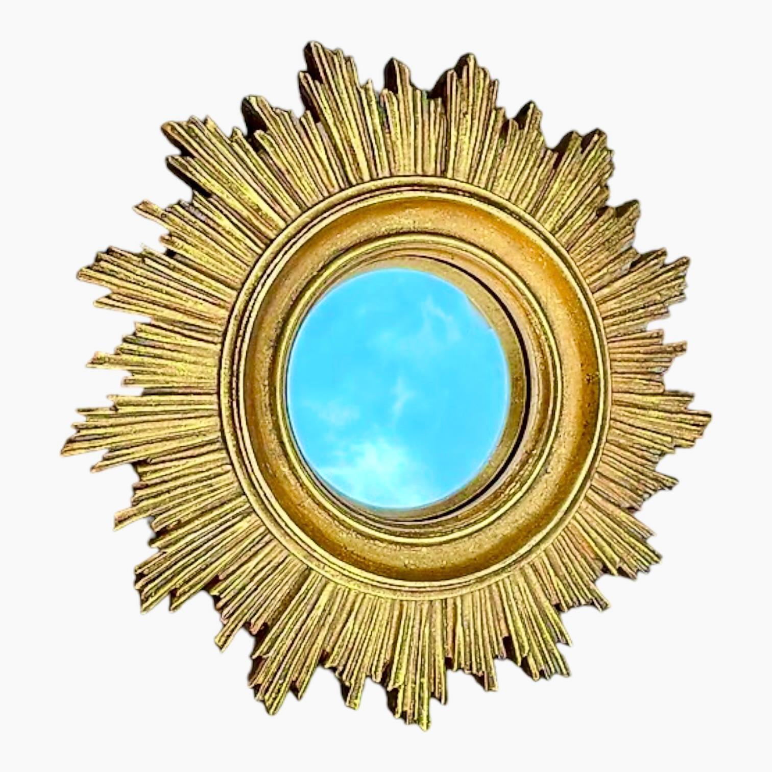 A cute sunburst or starburst mirror. Made of gilded composition. It measures approximate: 7