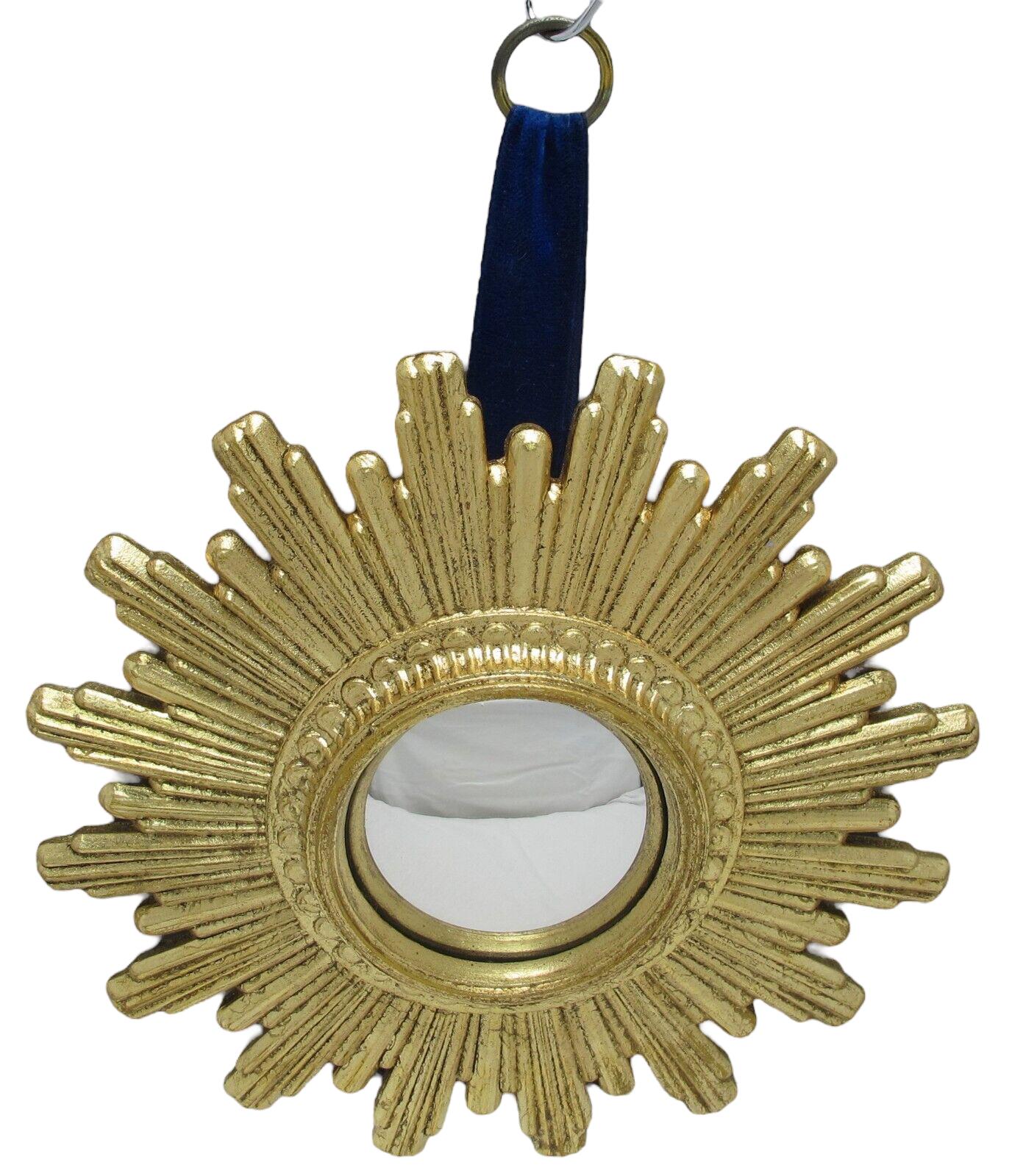 A cute sunburst or starburst mirror. Made of gilded composition. It measures approximate: 9.5