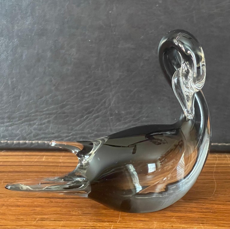Stylish petite swan sommerso art glass sculpture by Murano Glass, circa 1980s. The sommerso technique piece has a wonderful deep black color under the clear glass and is in very good condition with no chips or cracks (some scratches on the