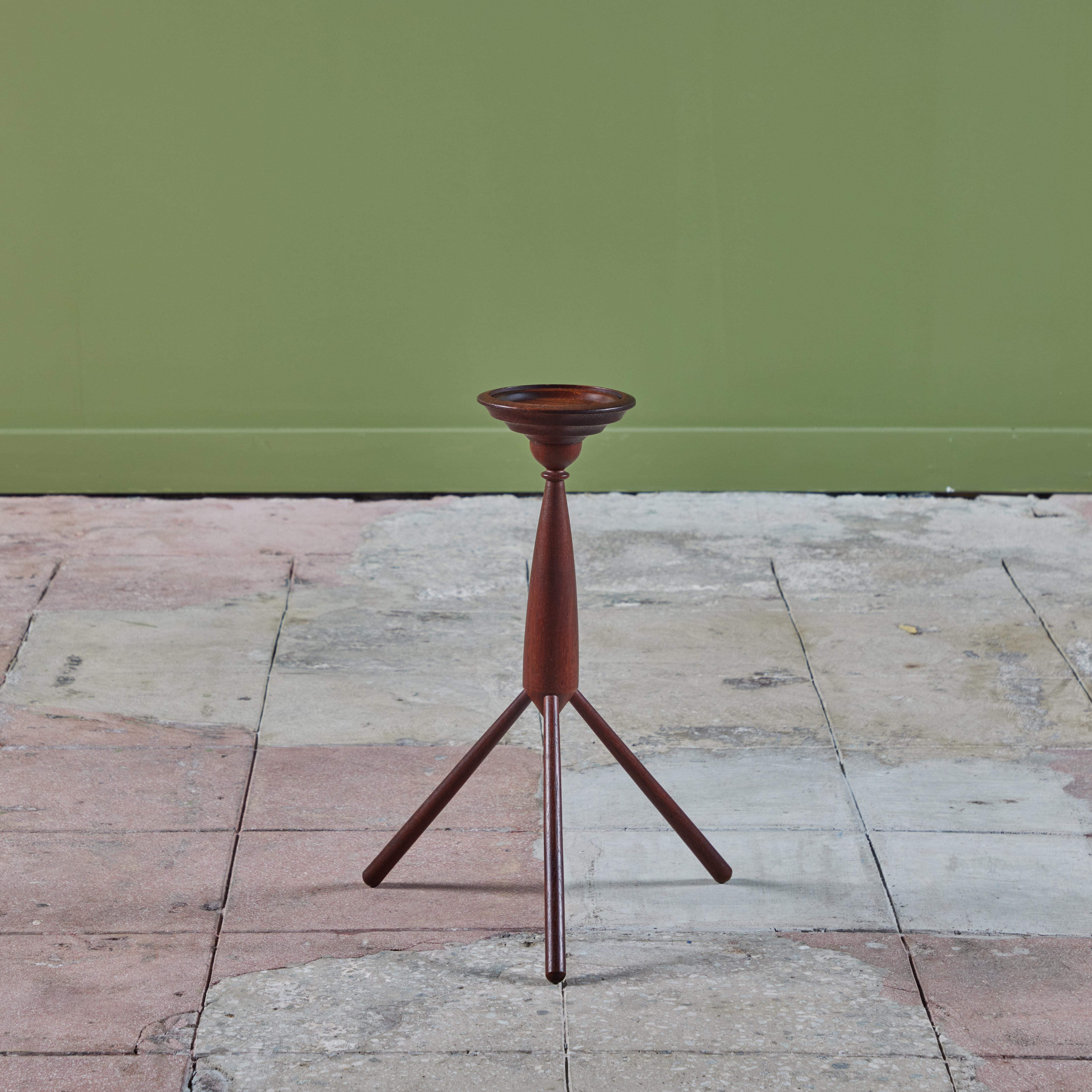 Teak tripod side table is supported by a teak shaft and three flared legs. The perfect petite table for an office, library or living area.

Dimensions 
13