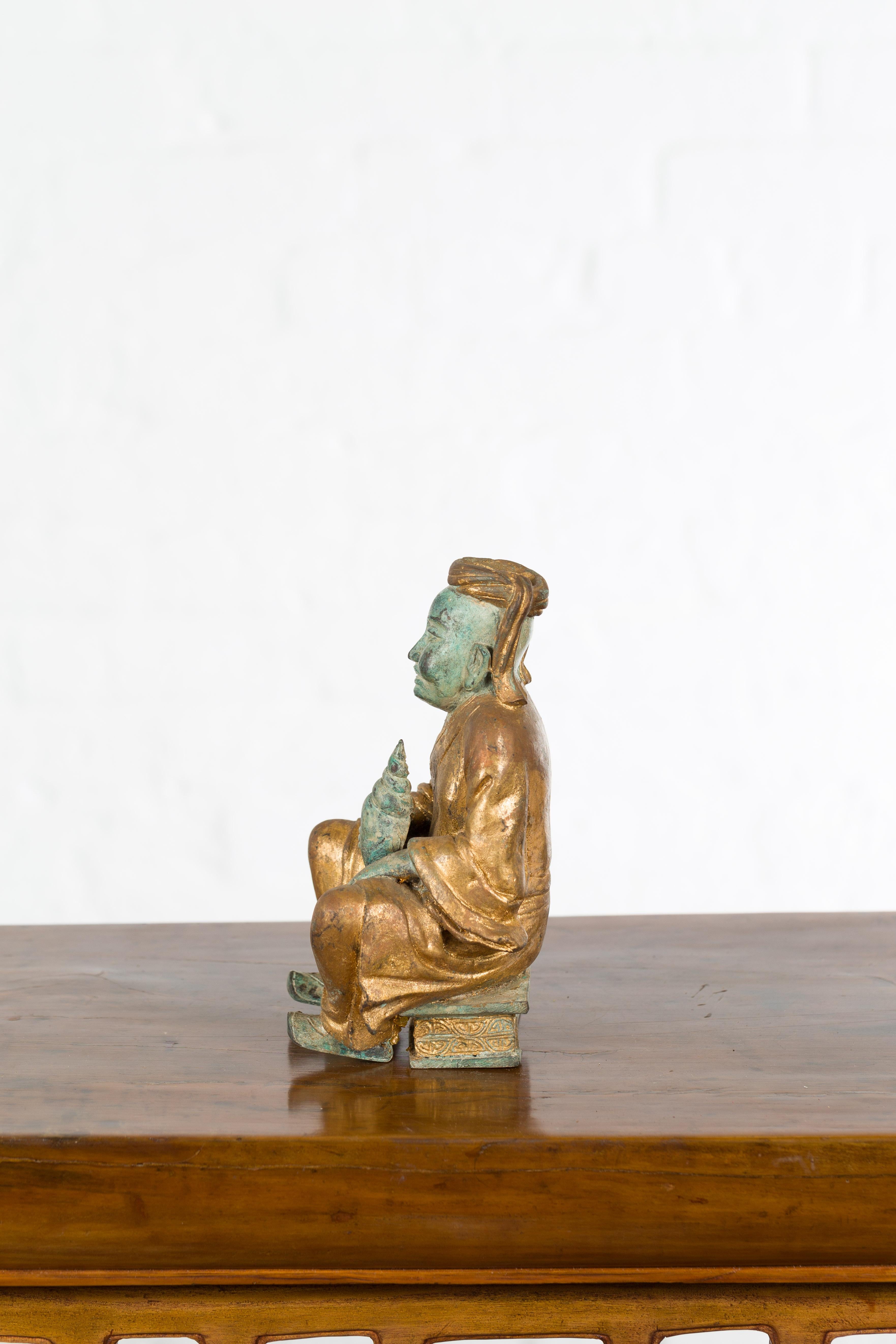 Petite Thai Verde and Gilded Statuette of a Seated Monk Holding a Conch Shell 4