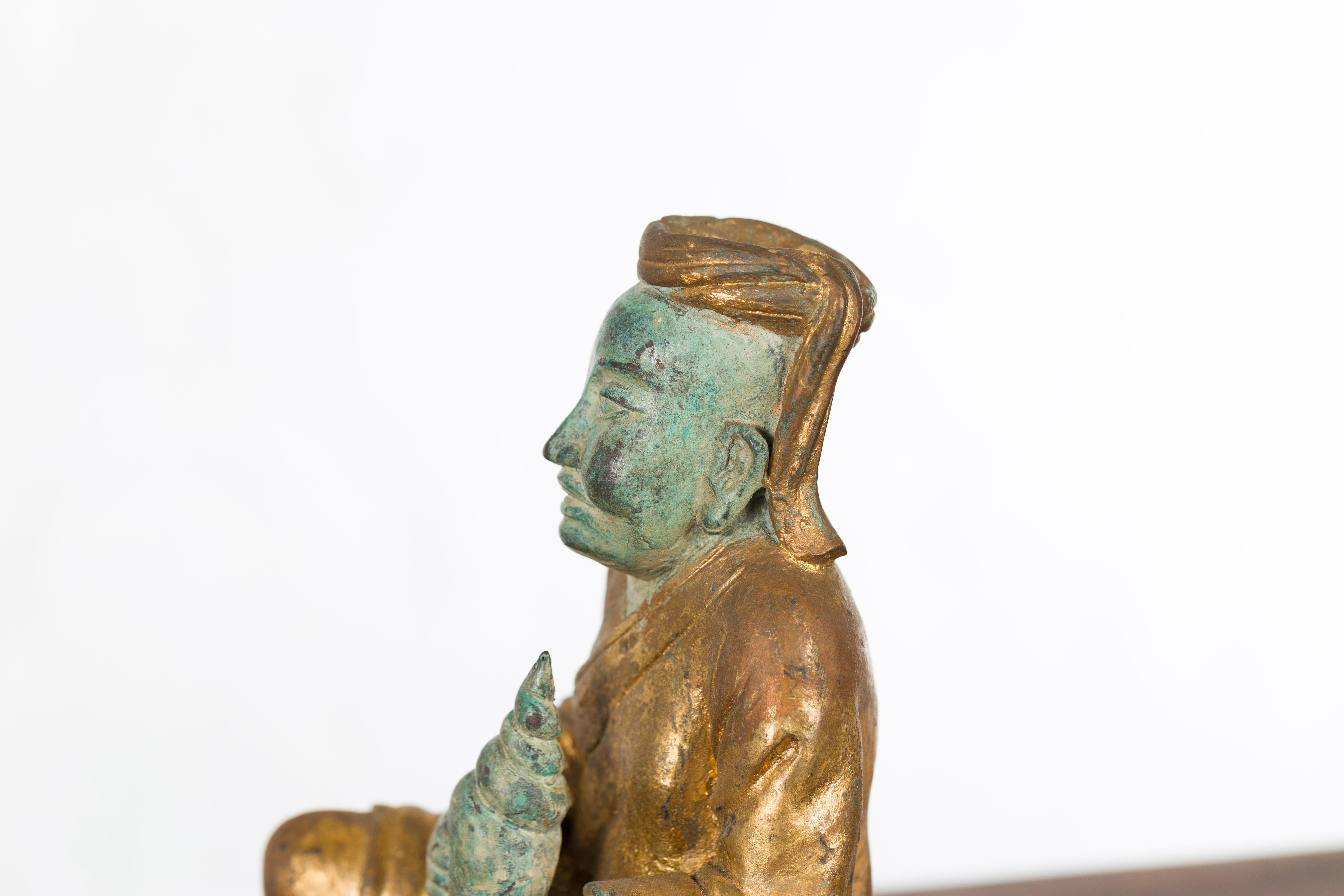 Petite Thai Verde and Gilded Statuette of a Seated Monk Holding a Conch Shell 5