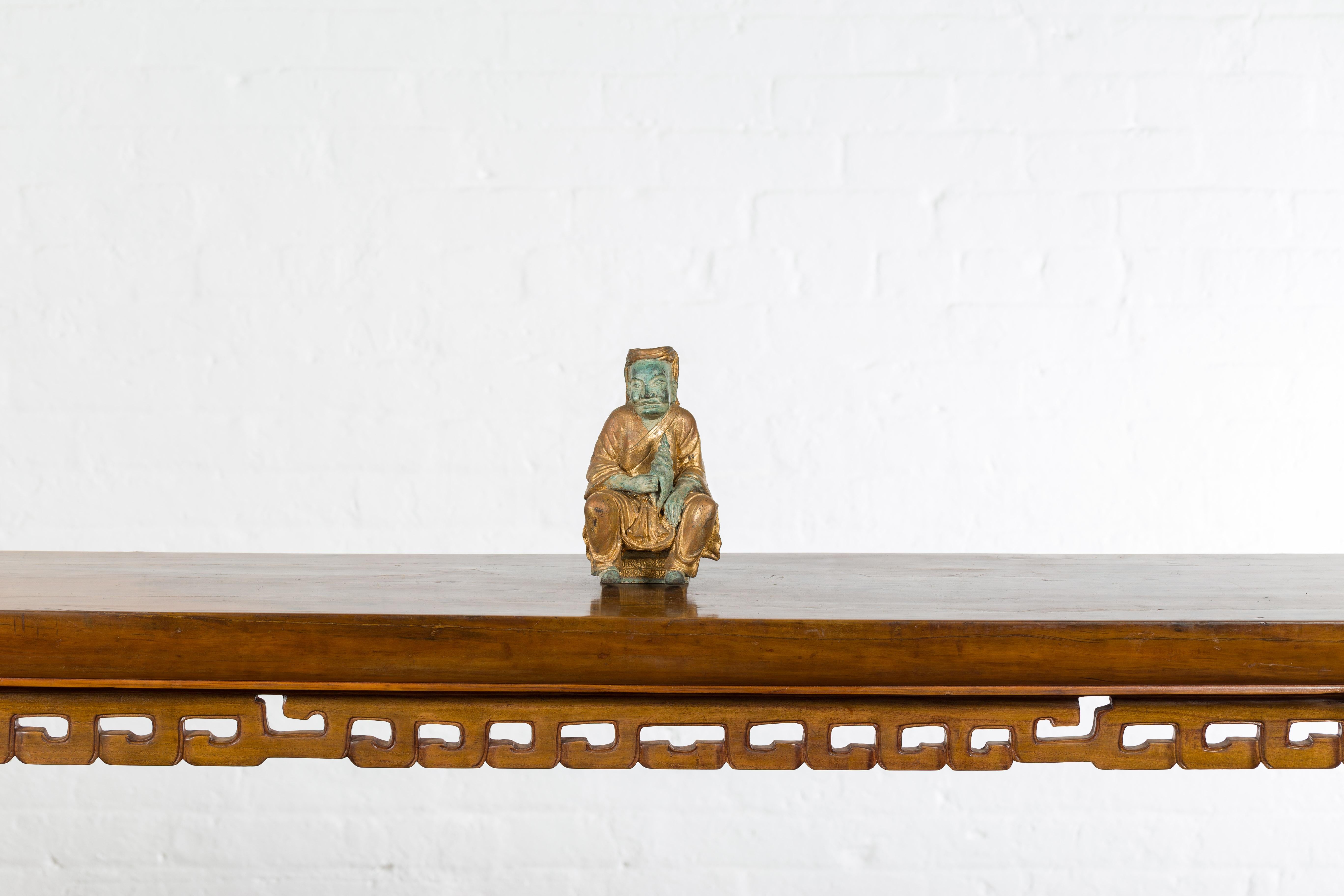 Gilt Petite Thai Verde and Gilded Statuette of a Seated Monk Holding a Conch Shell