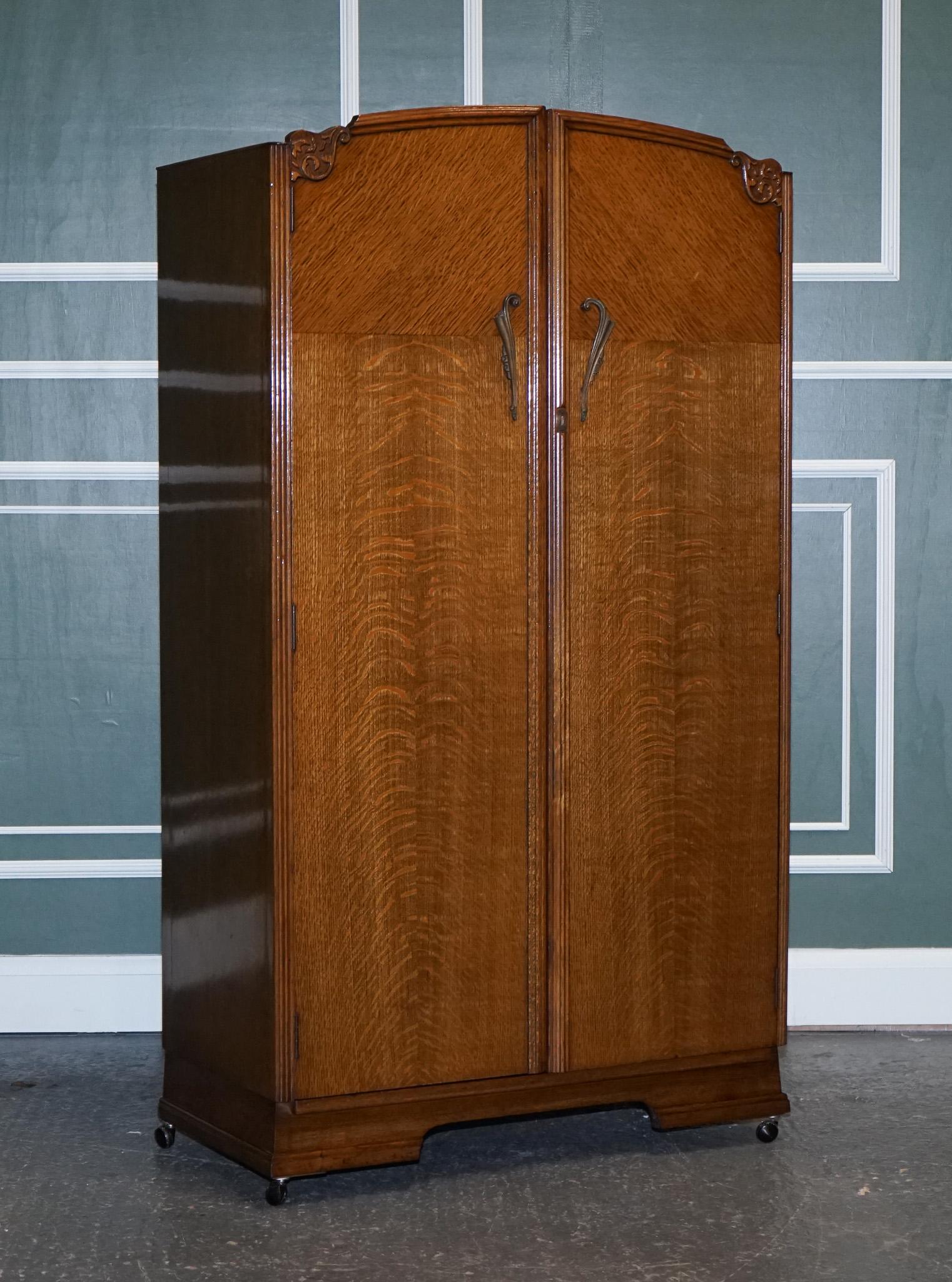 We are excited to offer for sale this petite vintage art deco oak two-door wardrobe.

An art deco wardrobe made from oak.
It is lifted on castors which makes it easy to move if needed and can be taken off if necessary.

On the inside, it's