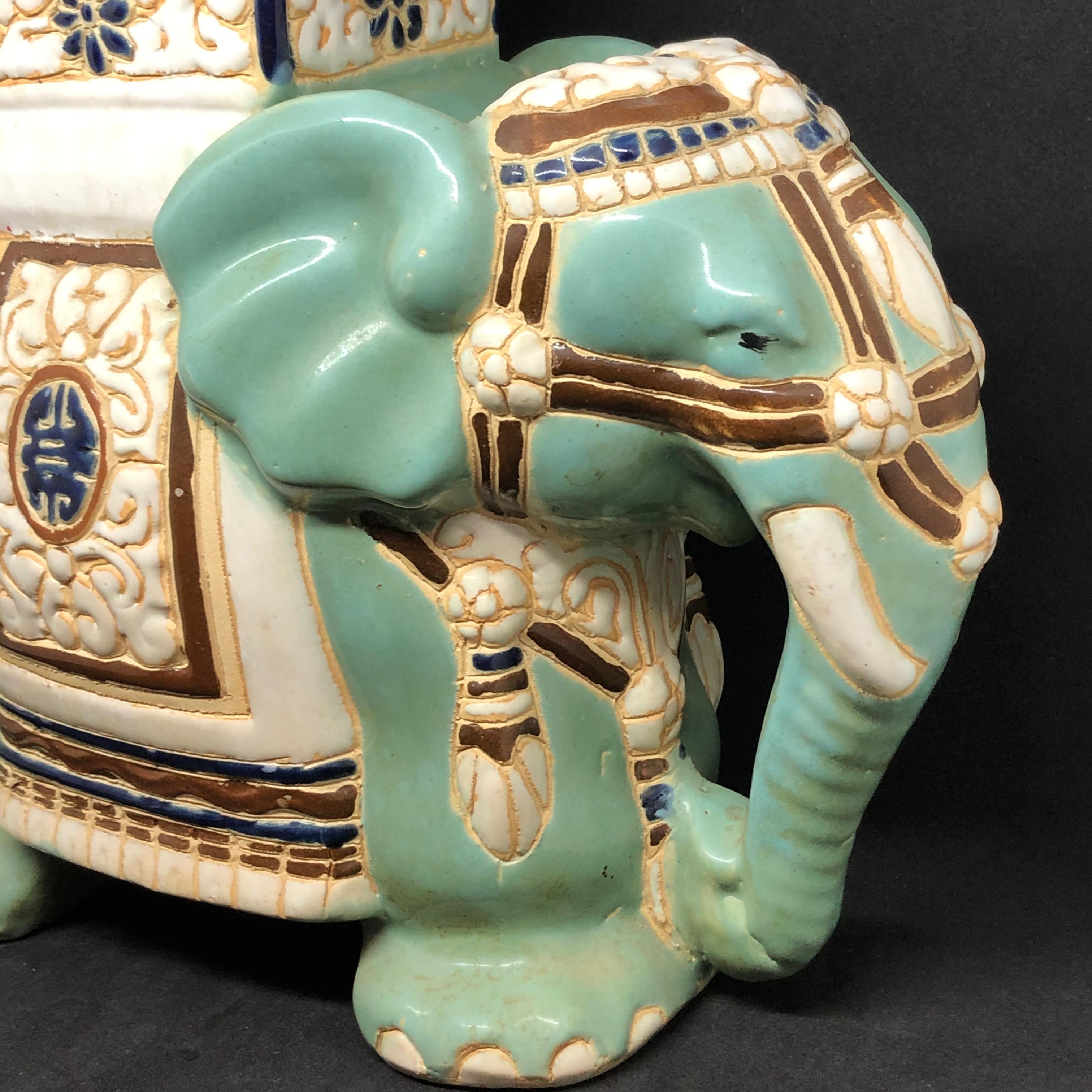 Petite mid-20th century glazed ceramic elephant flower pot seat. Handmade of ceramic. Nice addition to your home, patio or garden.
 