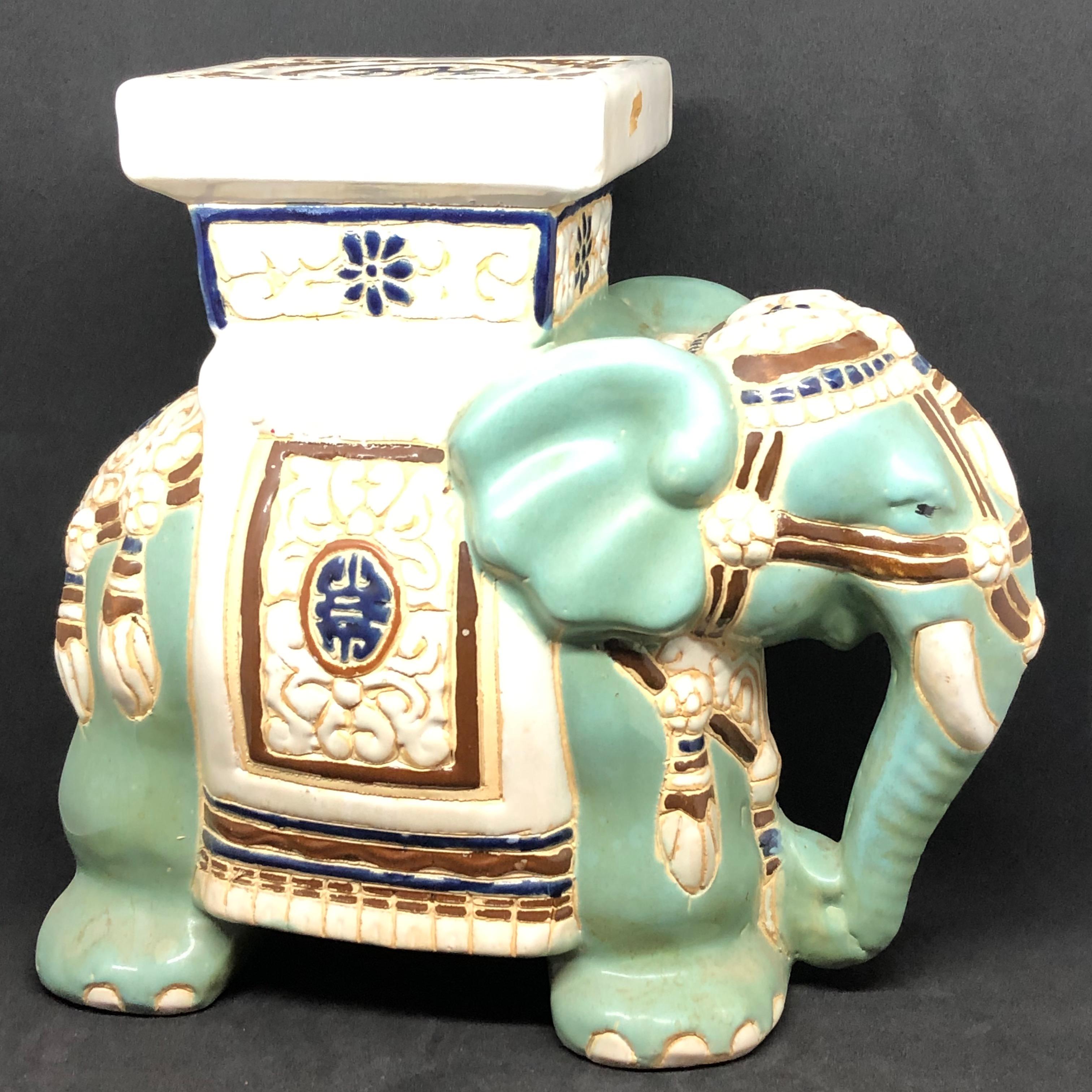 green ceramic elephant plant stand