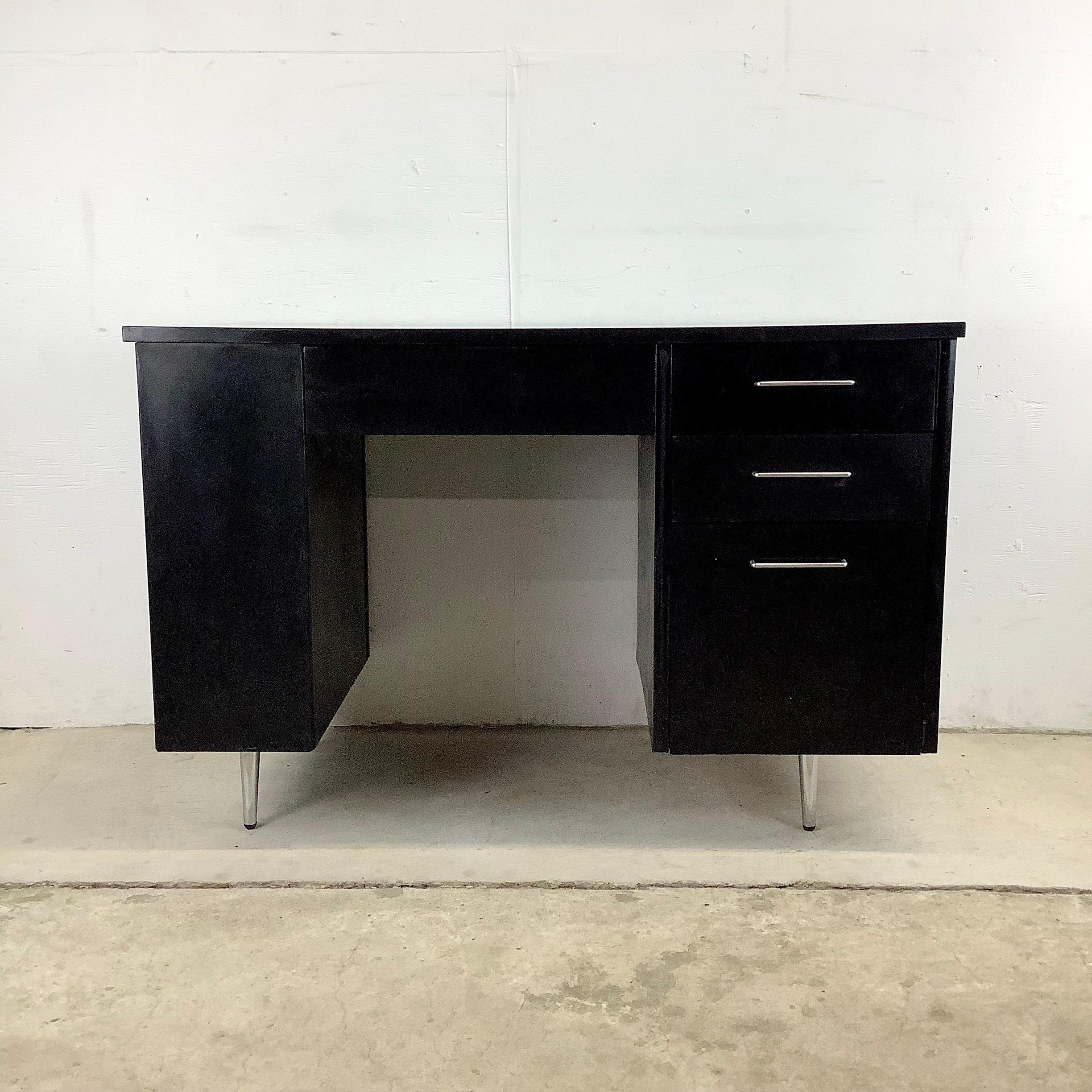 This striking vintage modern writing desk from Thonet Furniture features black lacquer finish and with finished back and bookshelf side it makes a striking addition in any interior setting. Petite sized but featuring plenty of storage the clean