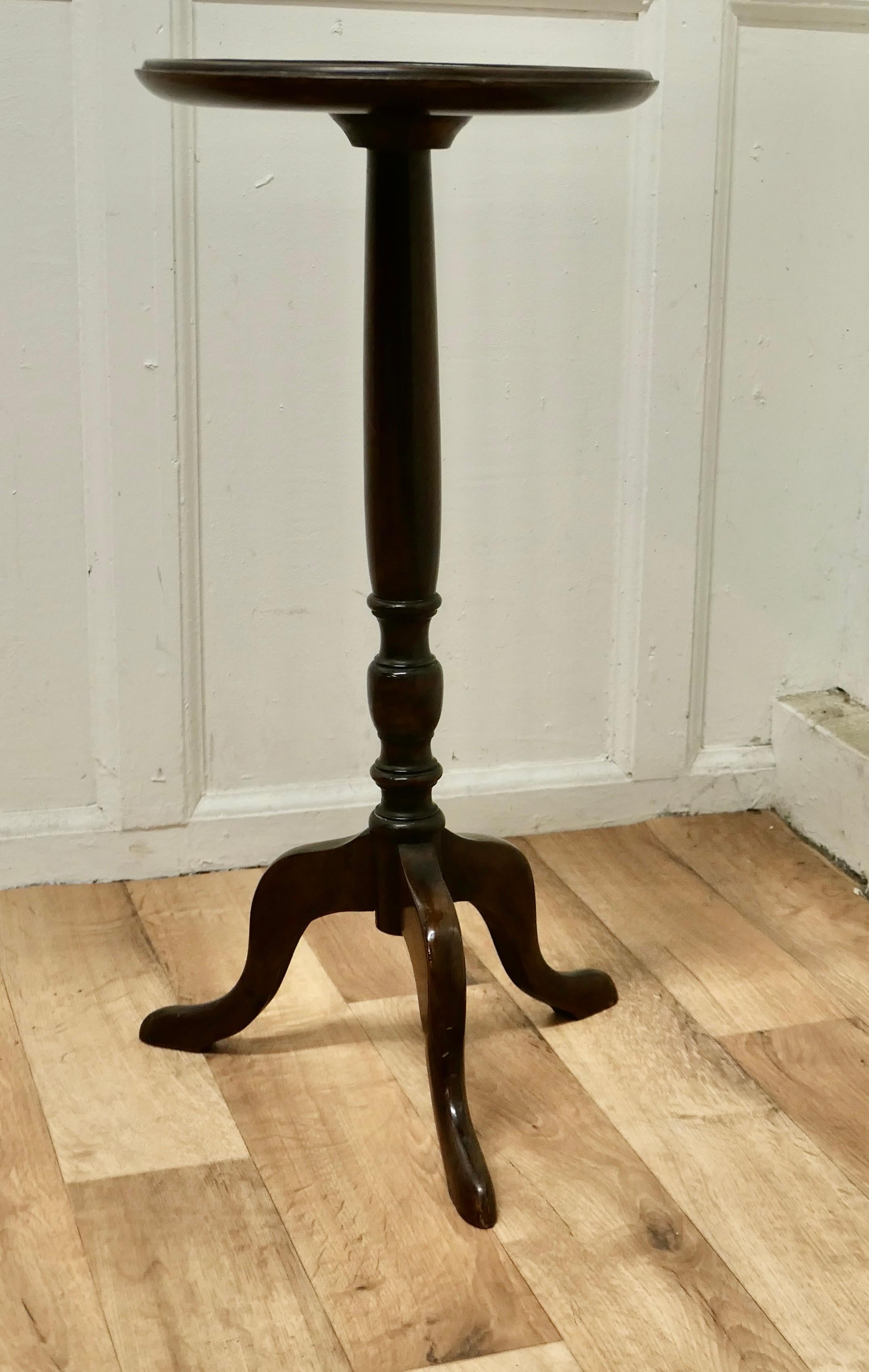 Petite walnut wine table

This lovely table stands on a three footed base and has a attractive turned centre leg.
The 1 piece round Walnut top has a dainty raised and moulded edge.
The table is in good sound condition there are a few ring marks