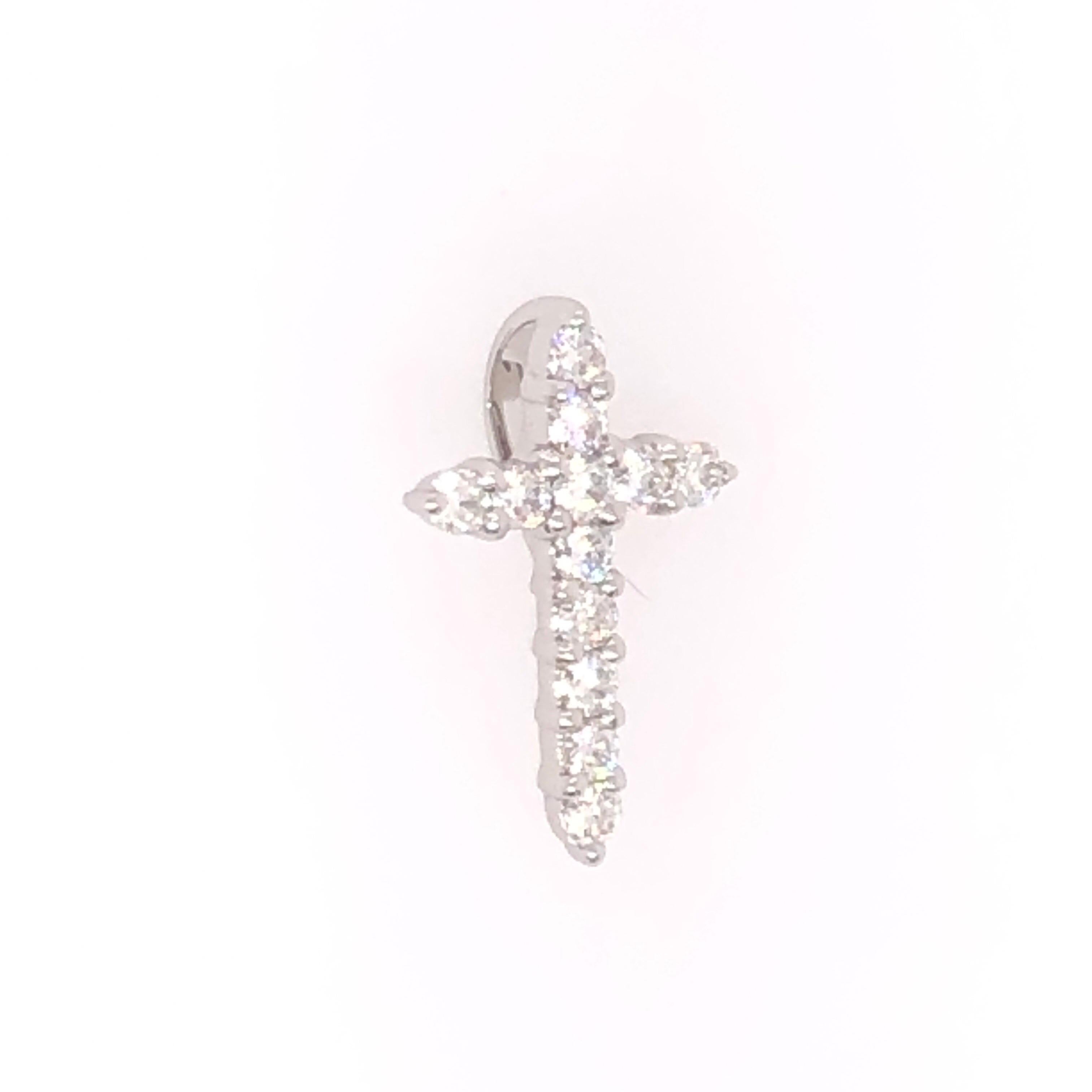 Beautiful petite 18K white gold and diamond cross pendant. A total weight of 0.27 CTS round cut diamonds catch the light for a touch of sparkle. 

This is a perfect gift for first communion or confirmation!