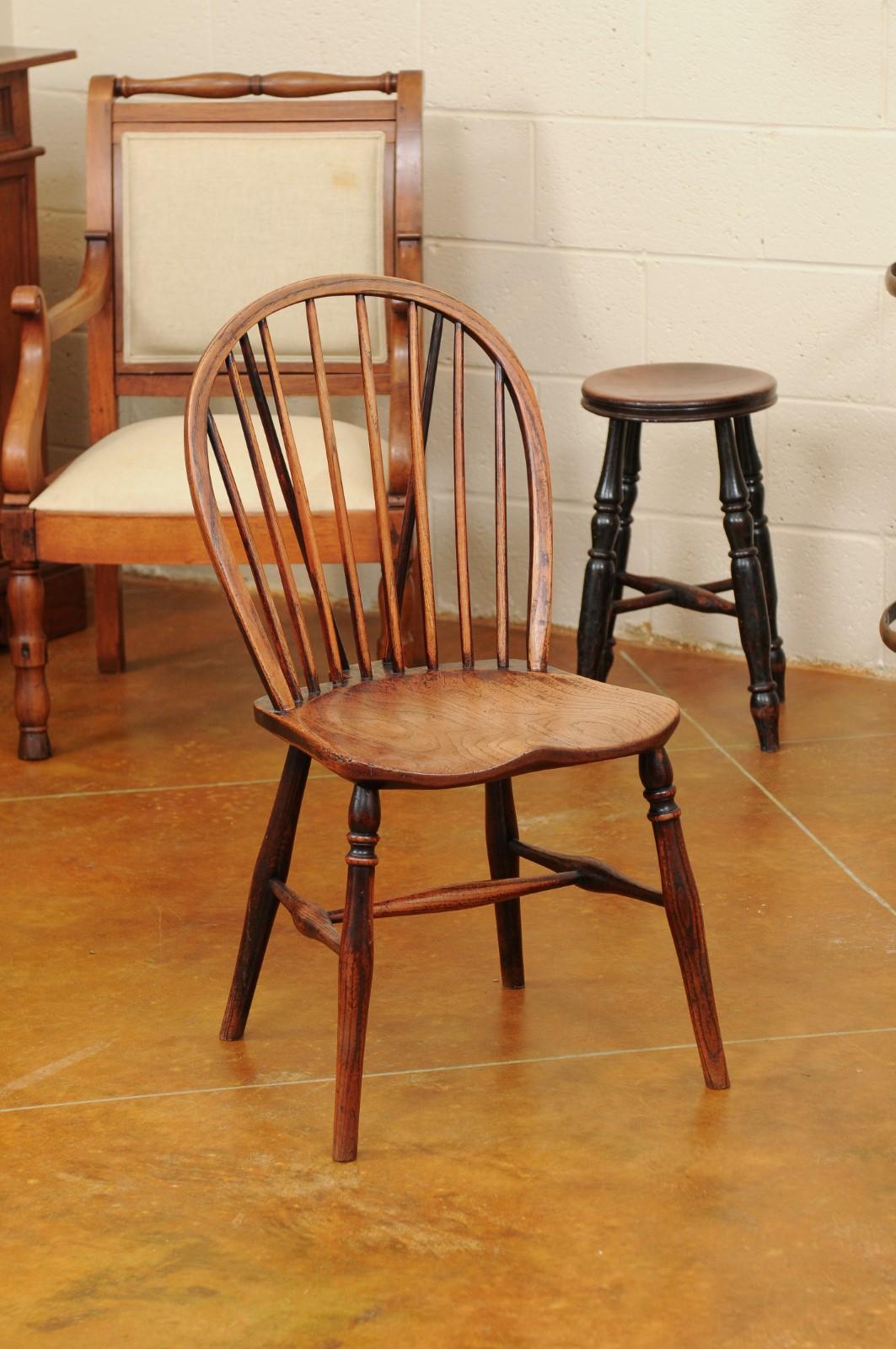 Petite oak Windsor chair with spindle back and turned legs & stretcher, England circa 1890.