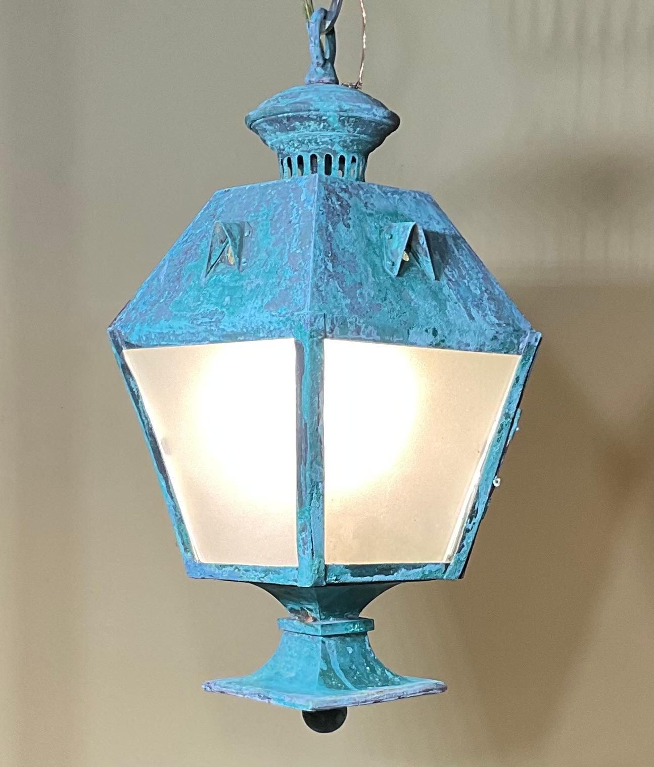 Exquisite antique copper hanging lantern through jam that will add a touch of vintage charm to any space. This petite Lantern is beautifully crafted to boost unique design with intricate detail and rich Patina .the  Lantern features a geometric