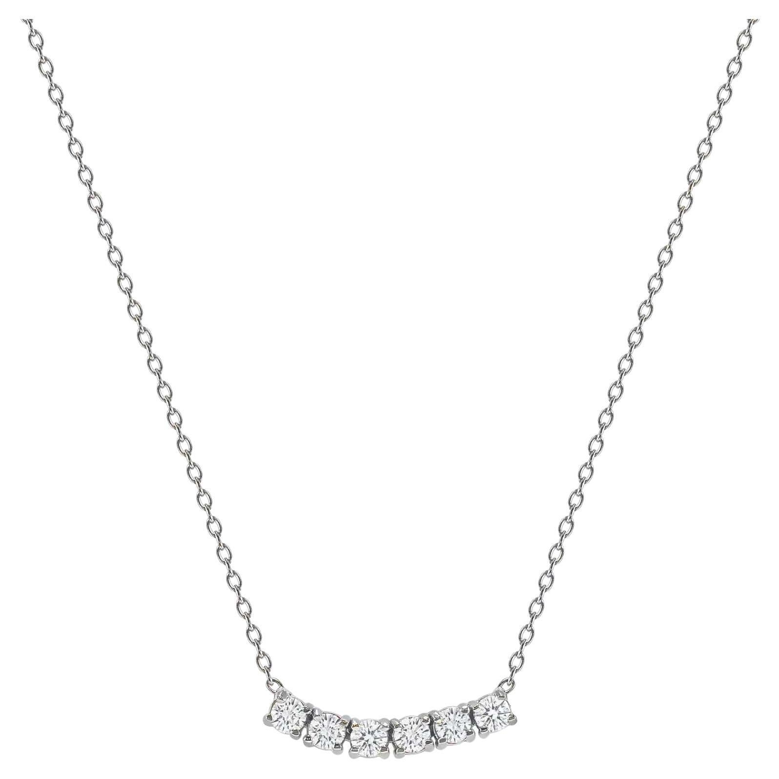This petite, curved diamond necklace is crafted with gorgeous 14k gold set with six round diamonds
 
Necklace Information
Gold : 14k 
Diamond Total Carats : 0.25ttcw
Diamond Cut : Round (6 diamonds)
Diamond Clarity : VS
Diamond Color : F-G
Color :