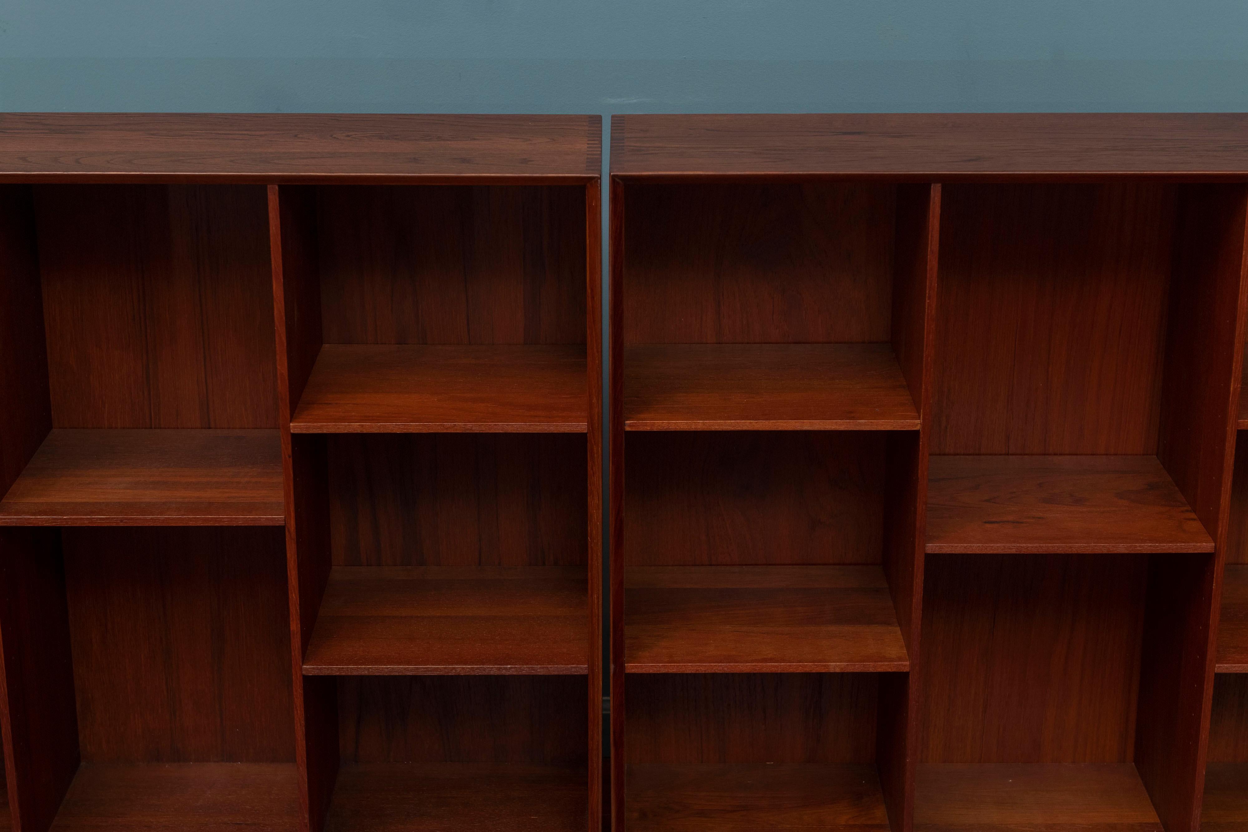 Peter Hvidt & Orla Moregaard-Nielsen design solid teak bookcases. Newly refinished with adjustable shelves that are simple but sophisticated and displays books or collectibles perfectly. Ready to install and enjoy.