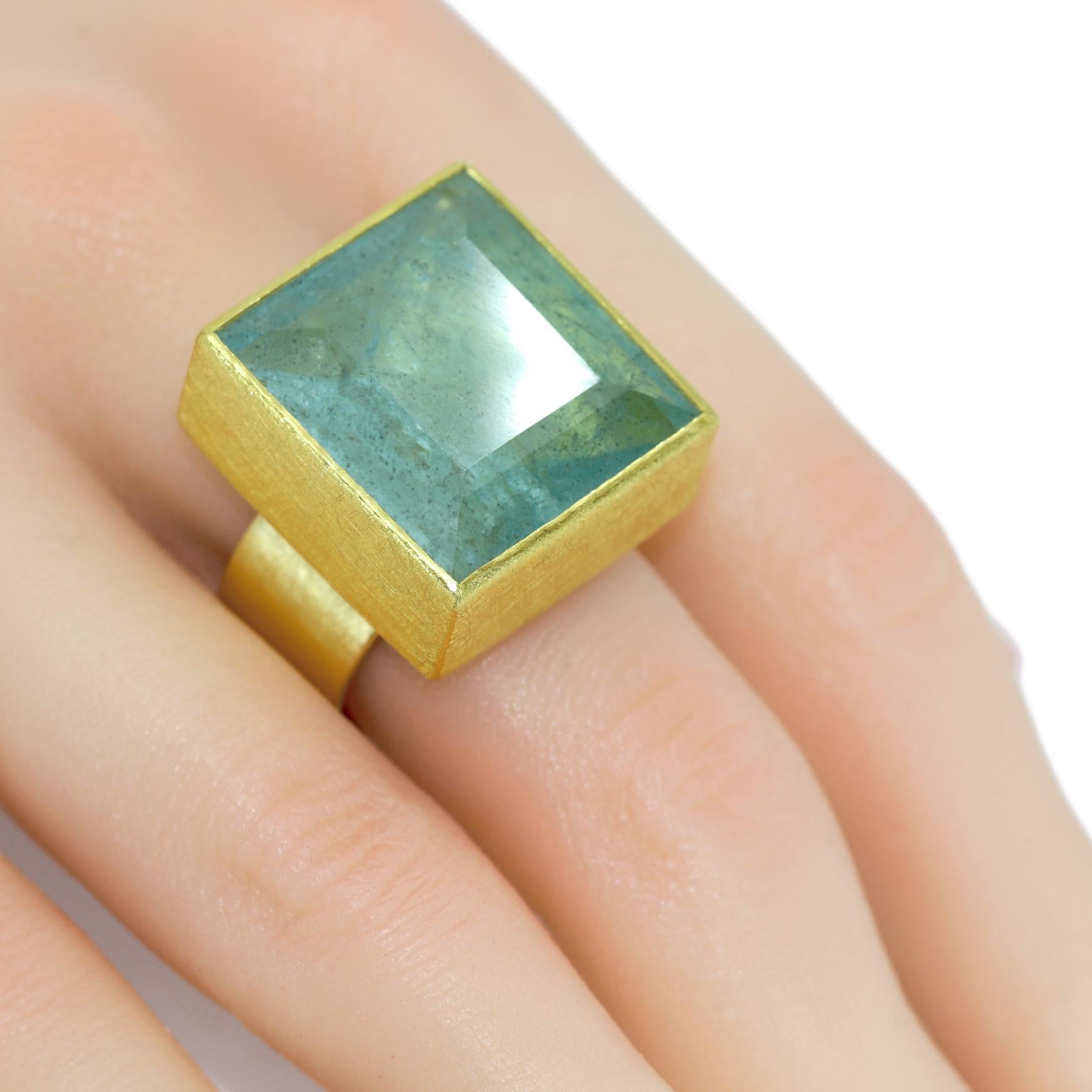 One of a Kind Statement Ring hand-fabricated by acclaimed jewelry maker Petra Class in signature-finished 22k yellow gold featuring a remarkable and unusual 28.0 carat natural faceted aquamarine square bezel-set atop a 10mm wide 18k yellow gold