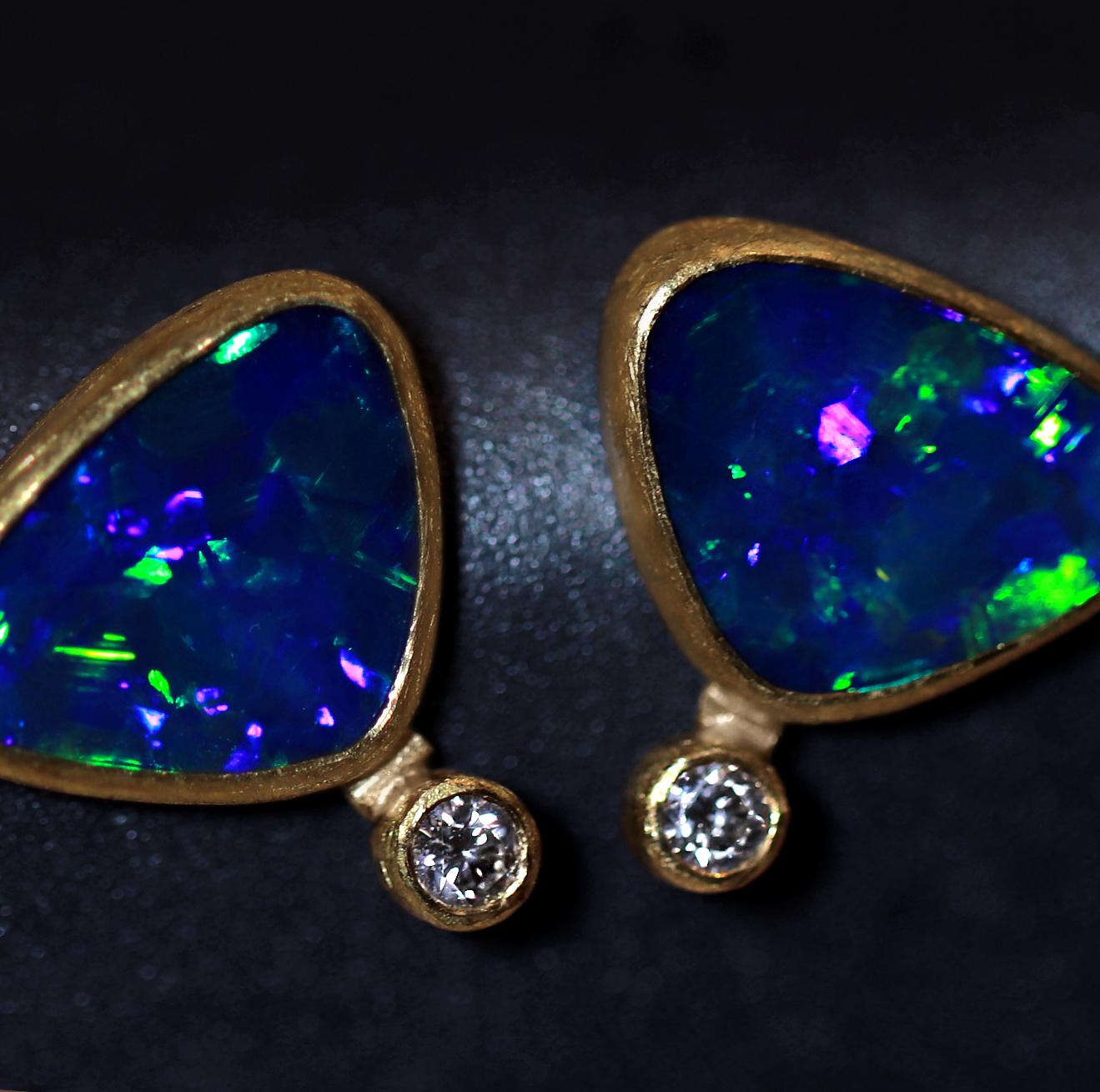 Electric Flash Stud Earrings handcrafted by acclaimed jewelry maker Petra Class featuring two matched Australian very deep blue opal doublets with strong electric neon green, blue, and violet flash, bezel-set in the artist's signature-finished 22k