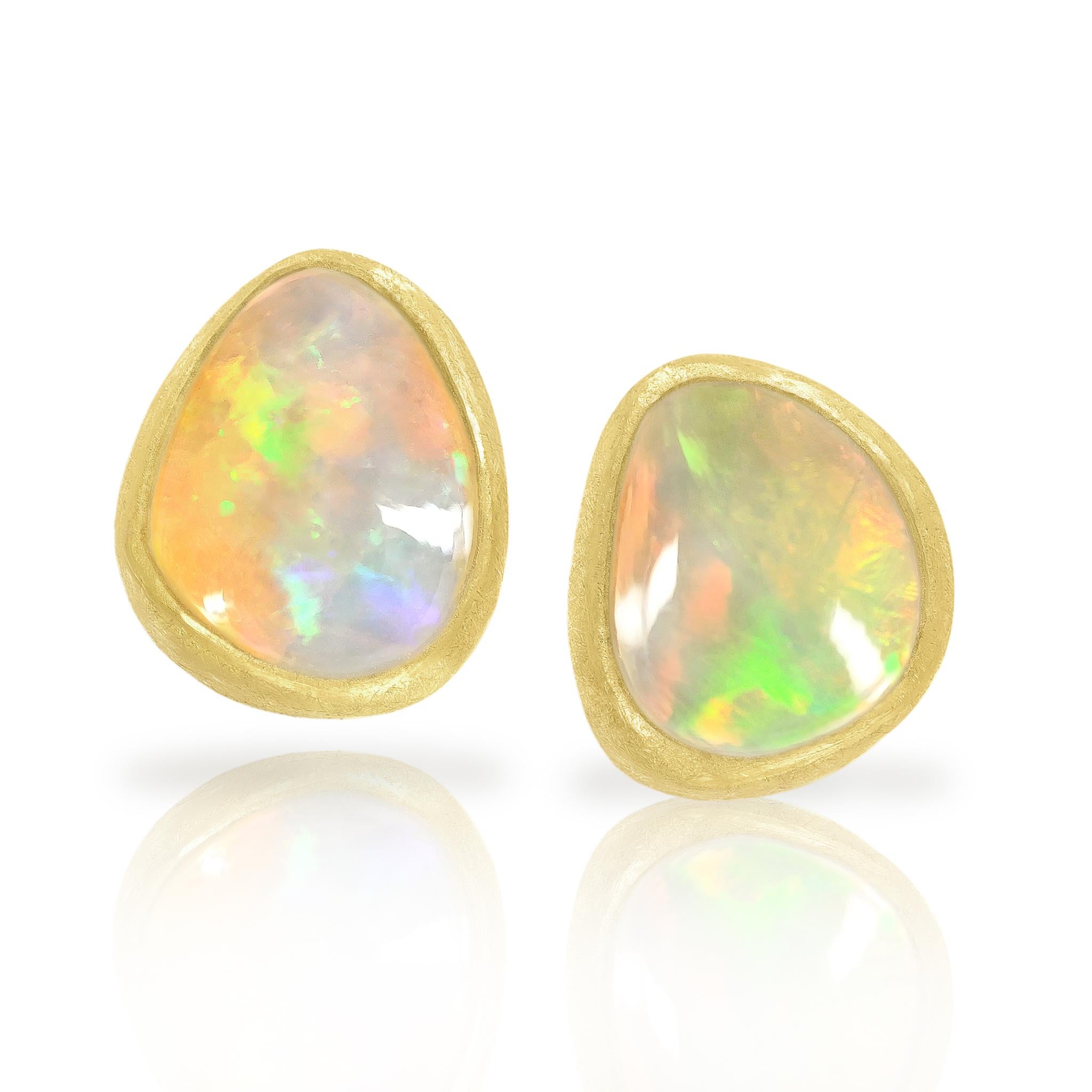 Freeform White Ethiopian Opal Cabochon Earrings handcrafted by acclaimed jewelry maker Petra Class featuring an exceptional matched pair of pure white Ethiopian opals with vivid electrifying rainbow fire, primarily in neon green and neon red. The