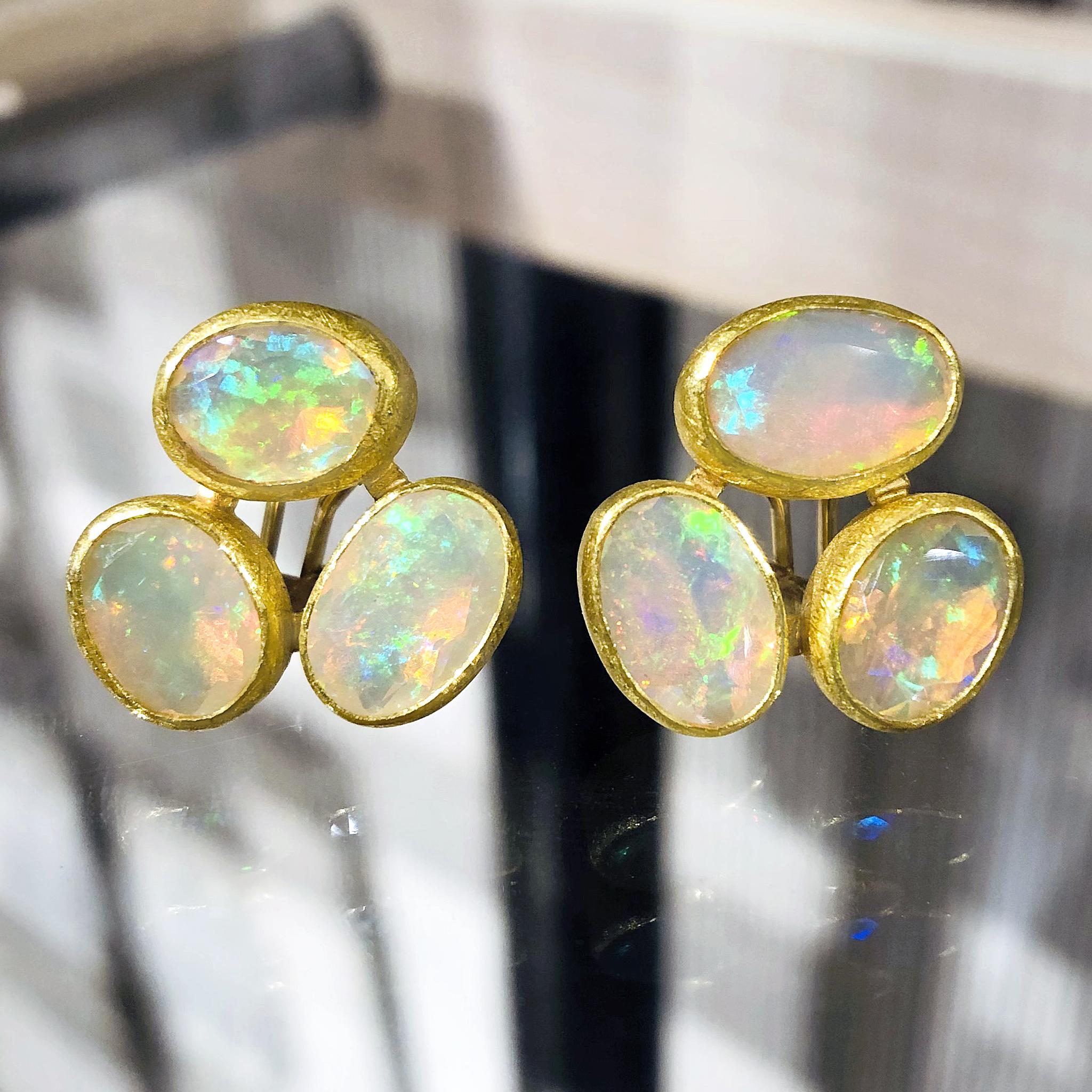 Triple Stud Earrings handmade by acclaimed jewelry maker Petra Class in signature finely-textured 22k yellow gold featuring four total carats of perfectly-matched faceted white Ethiopian opals with primary flashes of strong neon green and orange,