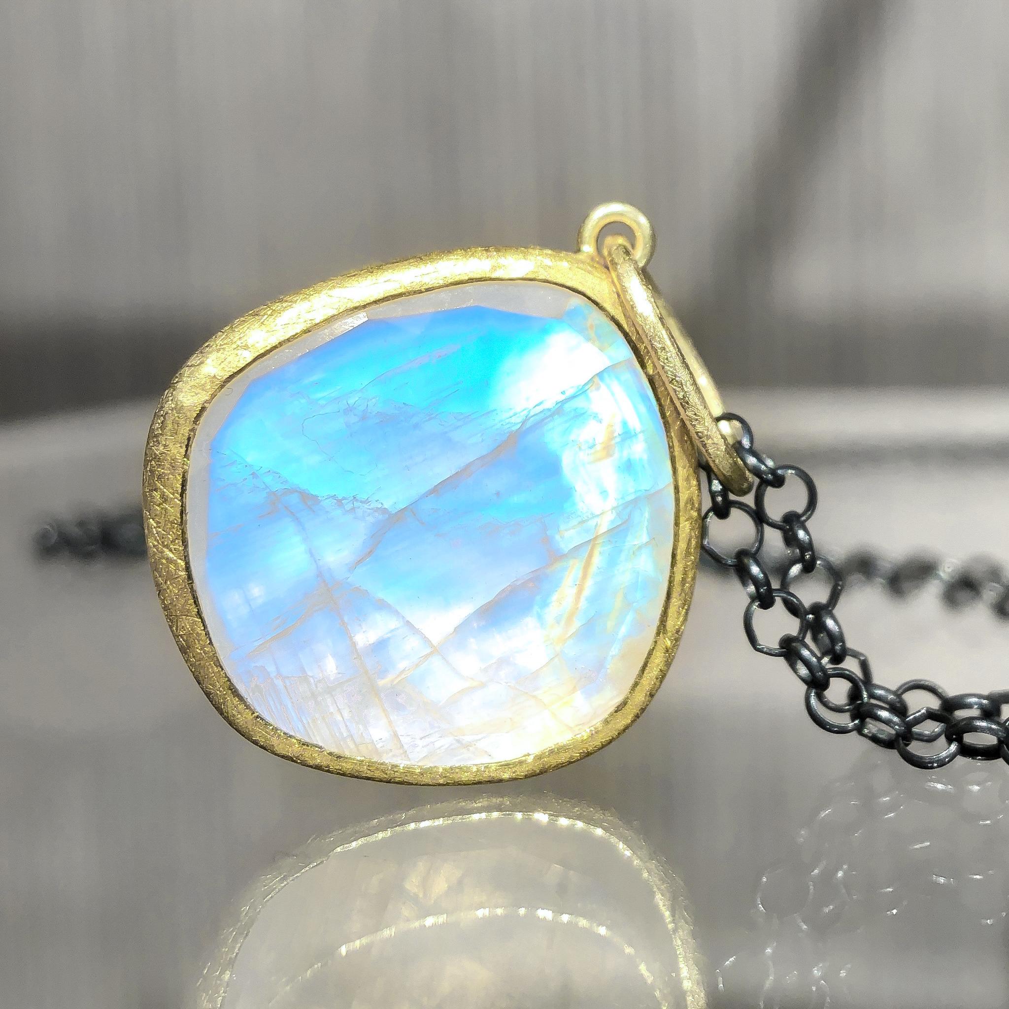 One of a Kind Necklace hand-fabricated by acclaimed jewelry maker Petra Class featuring a spectacular 11.3 carat faceted rainbow moonstone bezel-set in the artist's signature finely-textured 22k yellow gold. With a bail measuring 3/8 of an inch, the