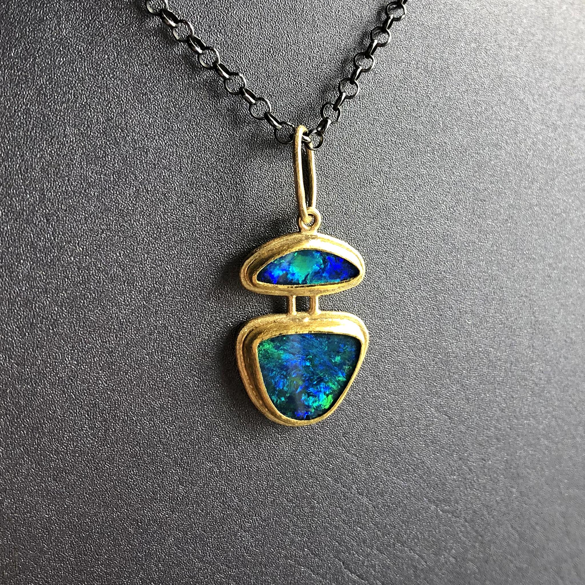 One of a Kind Necklace hand-fabricated by acclaimed jewelry maker Petra Class featuring two fiery Autralian opal doublets bezel-set in the artist's signature finely-textured 22k yellow gold. With a bail measuring 3/8 of an inch, the pendant can be