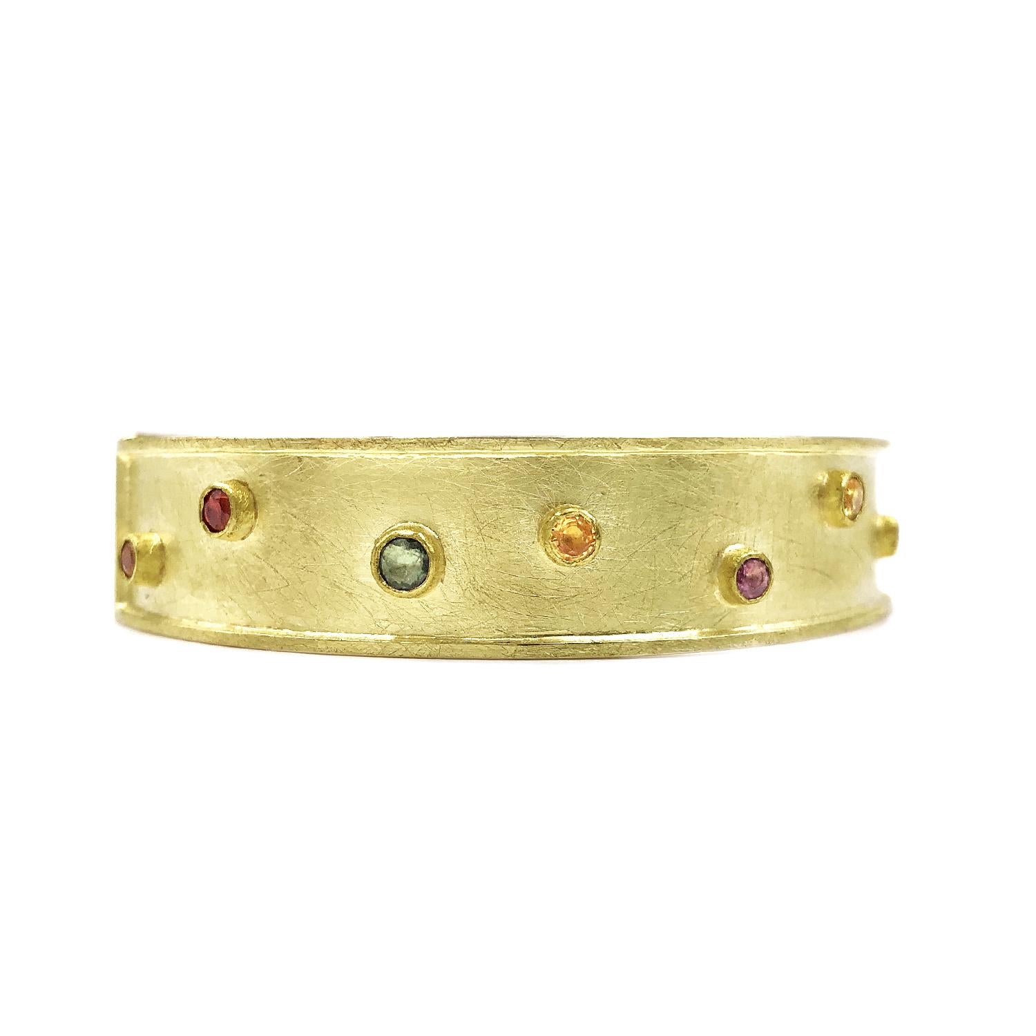 One of a Kind Dots Bracelet handcrafted by acclaimed jewelry maker Petra Class in a combination of signature-finished 22k yellow gold and 18k yellow gold featuring 2.50 total carats of assorted faceted round multicolored sapphires. 12mm width.