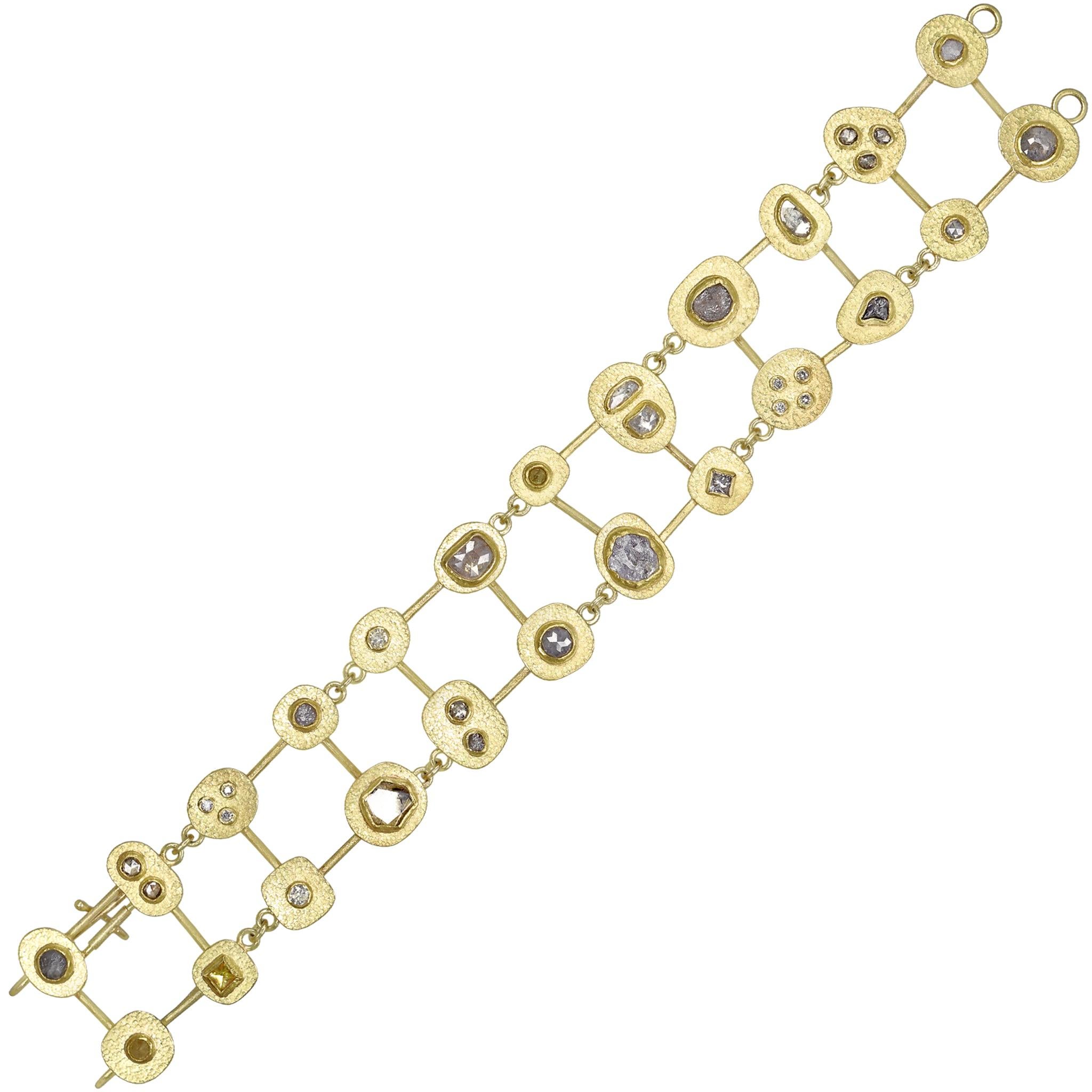 One of a Kind Segments Bracelet intricately hand-fabricated in signature silk-finished 22k yellow gold by acclaimed jewelry artist Petra Class showcasing 6.60 total carats of assorted natural diamonds comprised of round brilliant-cut, princess-cut,