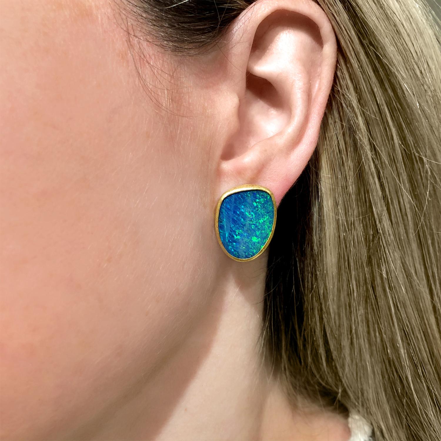 Large Stud Earrings handmade by acclaimed jewelry artist Petra Class in signature finely-textured 22k yellow gold featuring a beautifully matched pair of fiery Australian opal doublets primary flashes of strong neon green and flickers of violet,