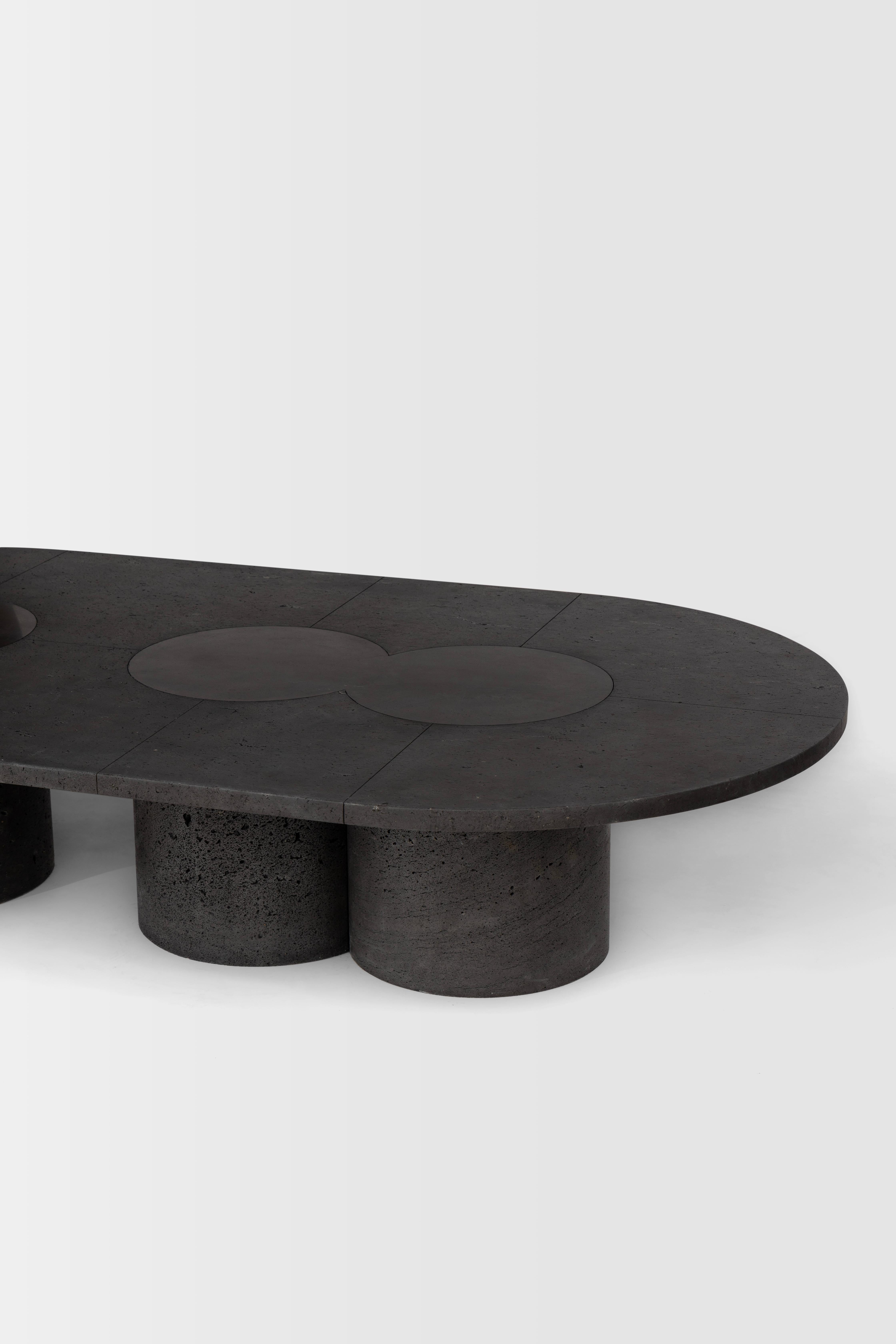Our reverence towards the sumptuousness of volcanic stone has led us to honor this noble material with a table/sculpture whose rich, porous top sits on top of three cylindrical monoliths born from the whims of Mexico’s volcanic terrain. Etched lines