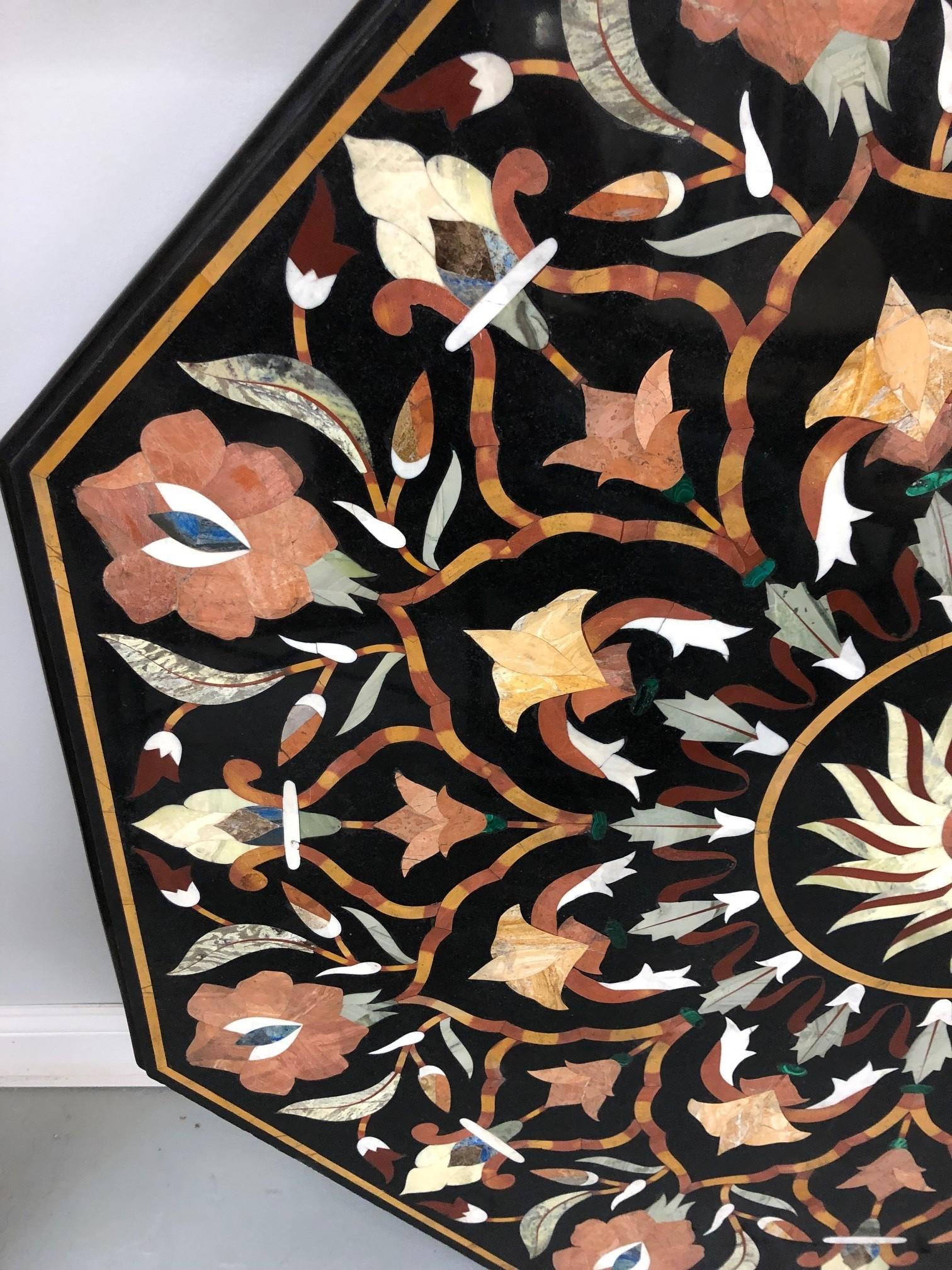 Beautiful Pietra Dura mosaic octagon dining table top black marble with semi precious stones. Each top is handmade making it very unique and a one of a kind piece.