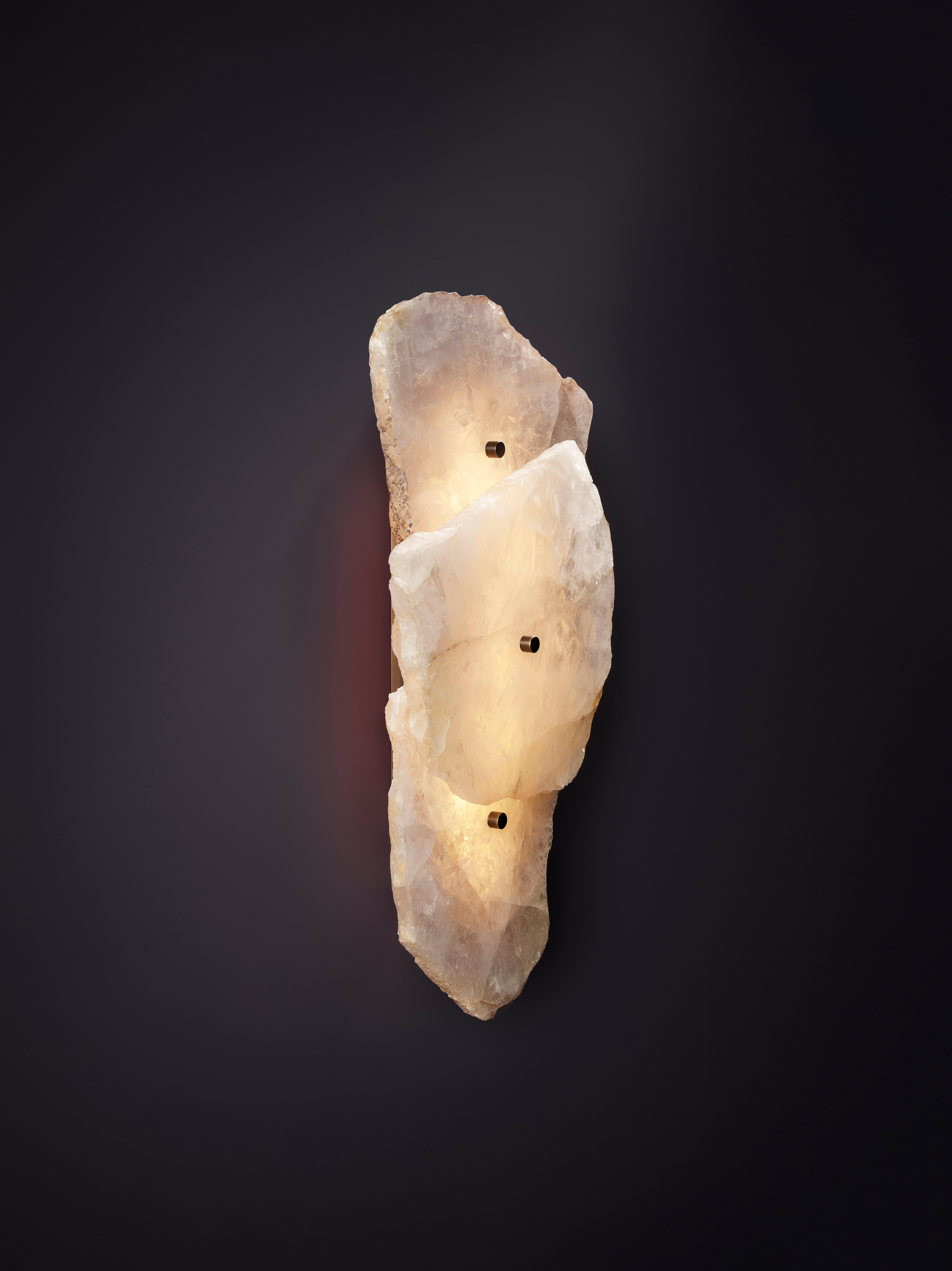 Petra I Triple Clear Quartz Sconce by Christopher Boots
Dimensions: D 12 x W 30 x H 60 cm.
Materials: Aged brass, slices of polished clear quartz.

Available in clear, rose, or smoky quartz. Please contact us.

PETRA (from the Greek word Πέτρα,