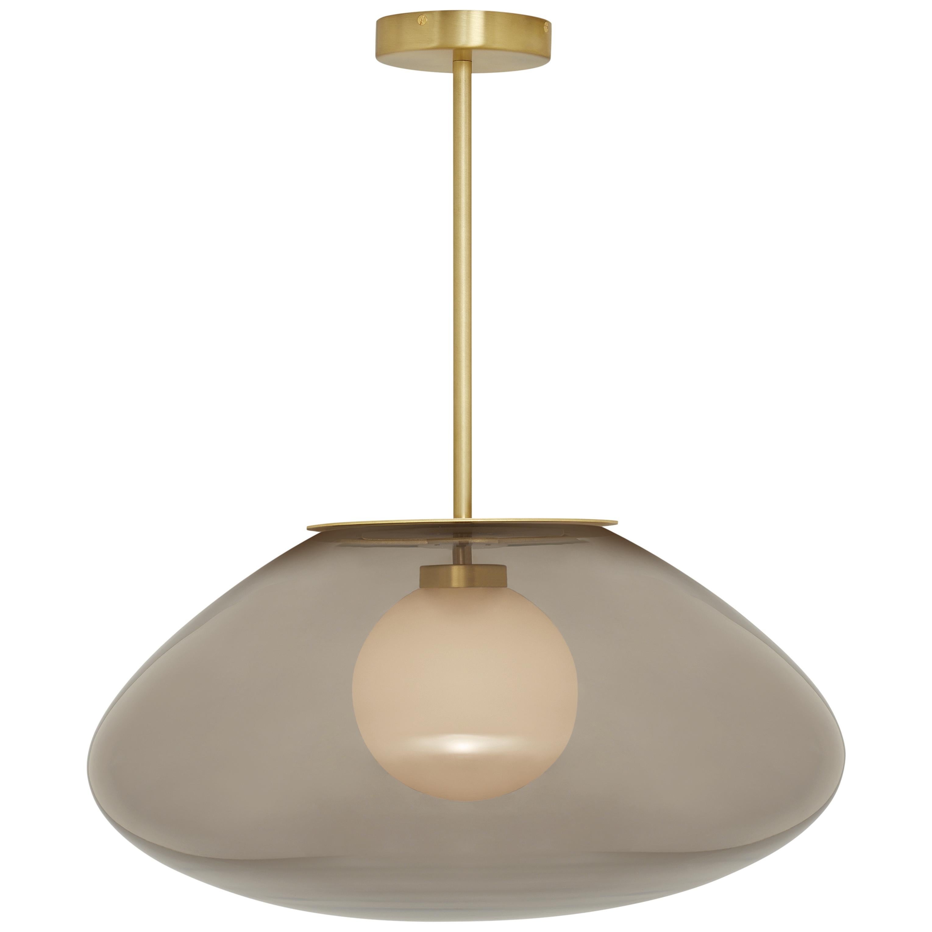 Petra large pendant by CTO Lighting
Materials: satin brass with smoked glass shade and hand shaped smoked glass inner shade
Also available in dark bronze with smoked glass shade and hand shaped smoked glass inner shade,
satin brass with smoked