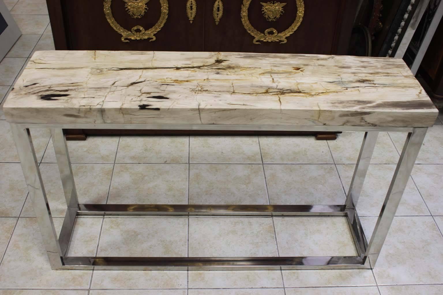 Elegant petrified wood console with stainless steel base. 25MA petrified wood top in one piece. White and beige color.
Dimensions: L 110cm, H 65cm, D 30cm.