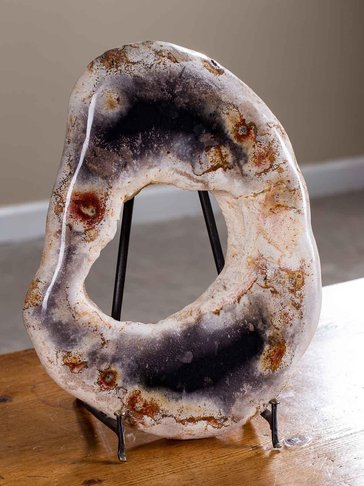 Polished Petrified Wood Ring Sculpture on Iron Stand