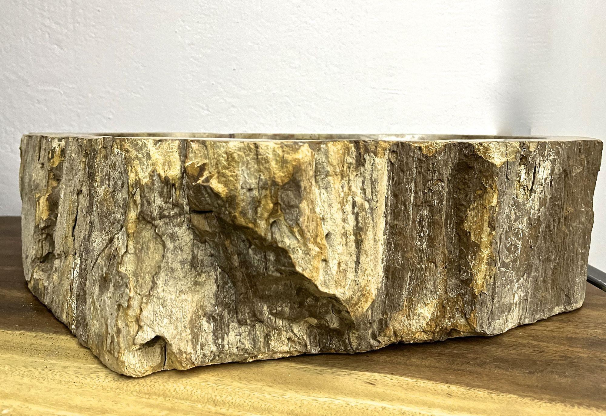 One of a kind Petrified wood sink in absolute top quality. This organic modern sink impresses with a fantastic natural shape and beautiful colors of different beige, brown, yellow and grey tones. The inside of the sink shows a polished surface with
