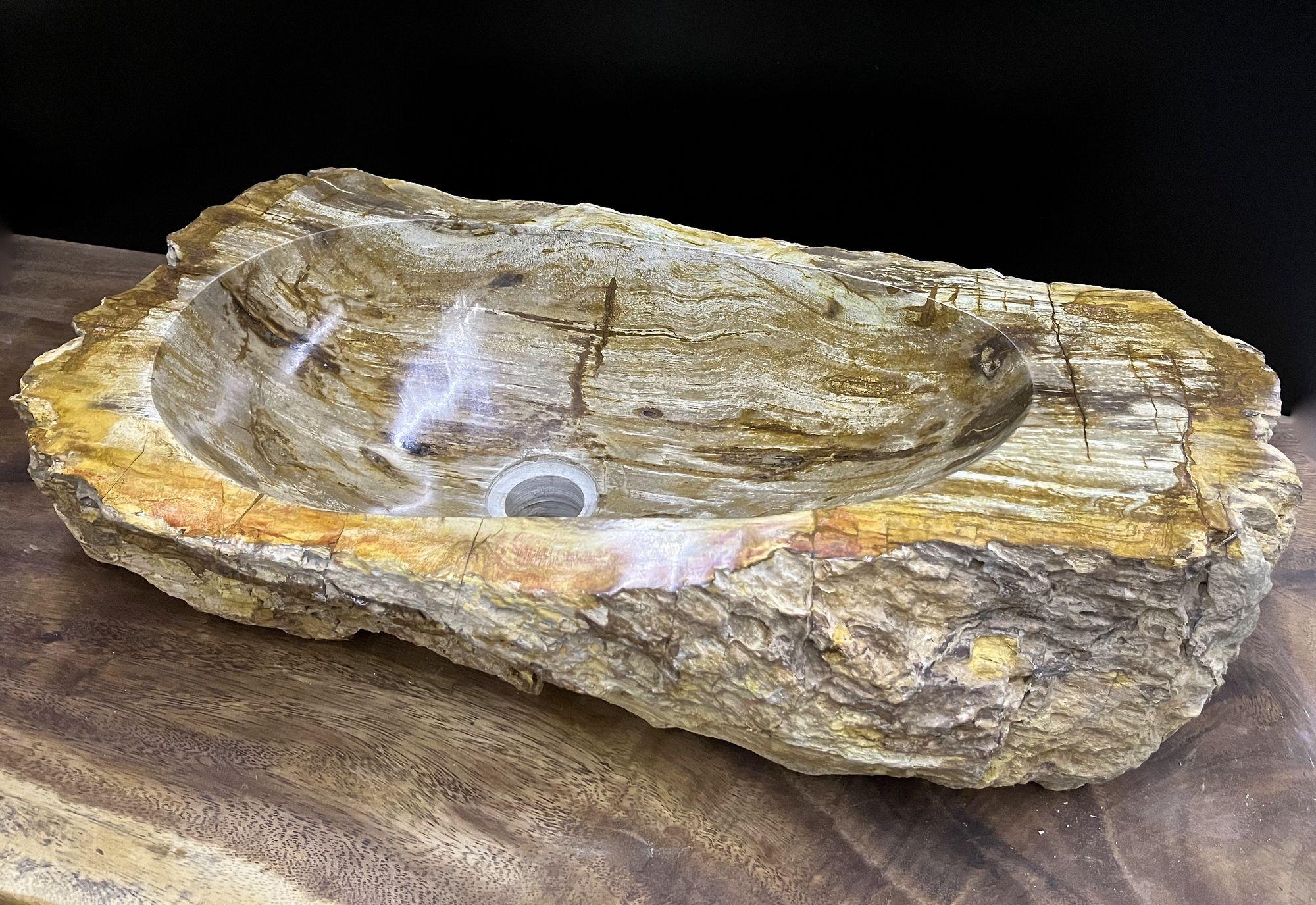 Outstanding looking petrified wood sink in absolute top quality with polished basin. The outstanding natural coloration in beige, brown and yellow tones is matchless. An exceptional piece elaborately worked out of petrified wood impressing with a