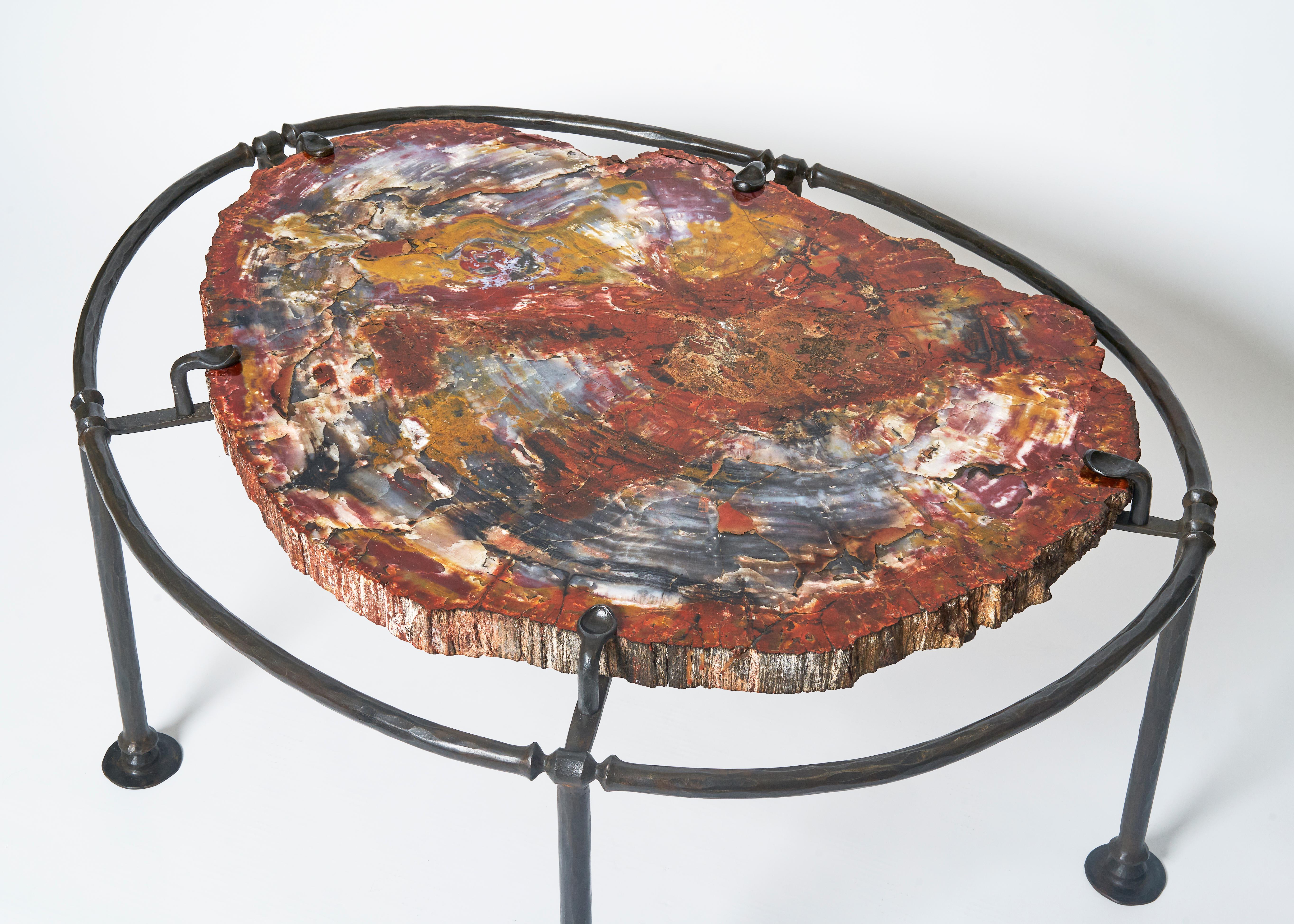 Wrought iron base and petrified wood top
Signed, Original Edition by JML.