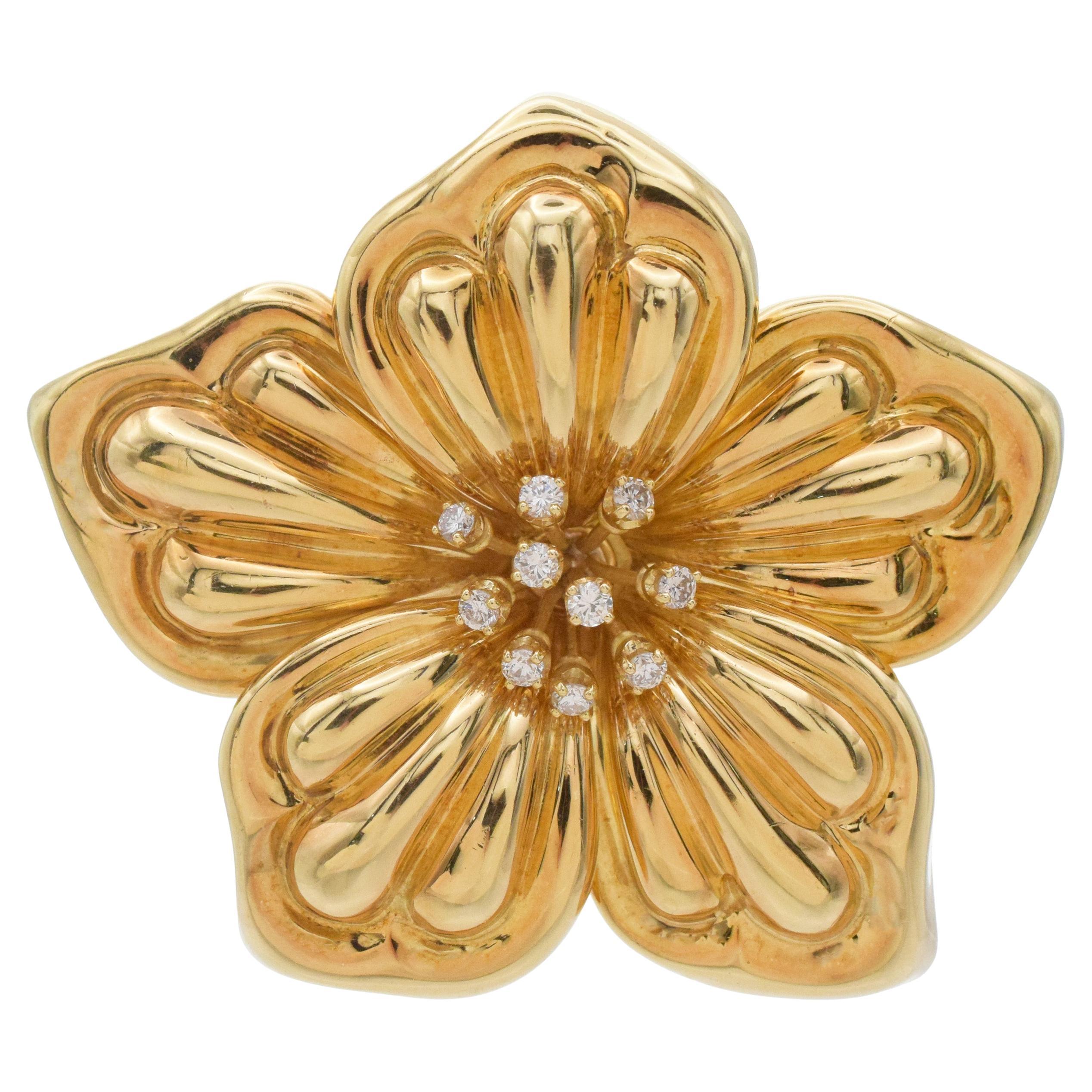 Broche flor Petro 
Tarkis de oro amarillo de 18 quilates y diamantes. en venta