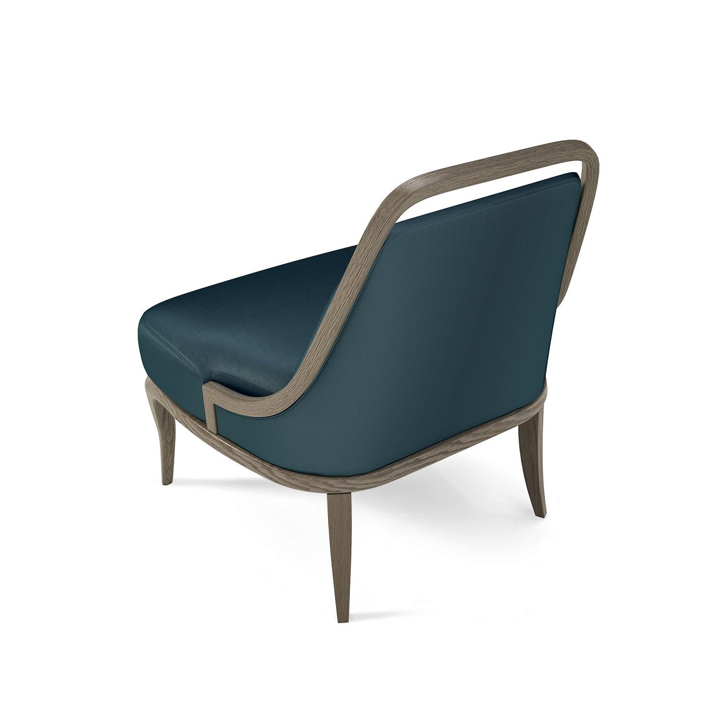 Exuding comfort and sophistication, this armchair is an ingenious piece of functional decor crafted of modern, durable materials. It is composed of an ashwood structure with a tall backrest, padded of polyurethane foam and upholstered of bright