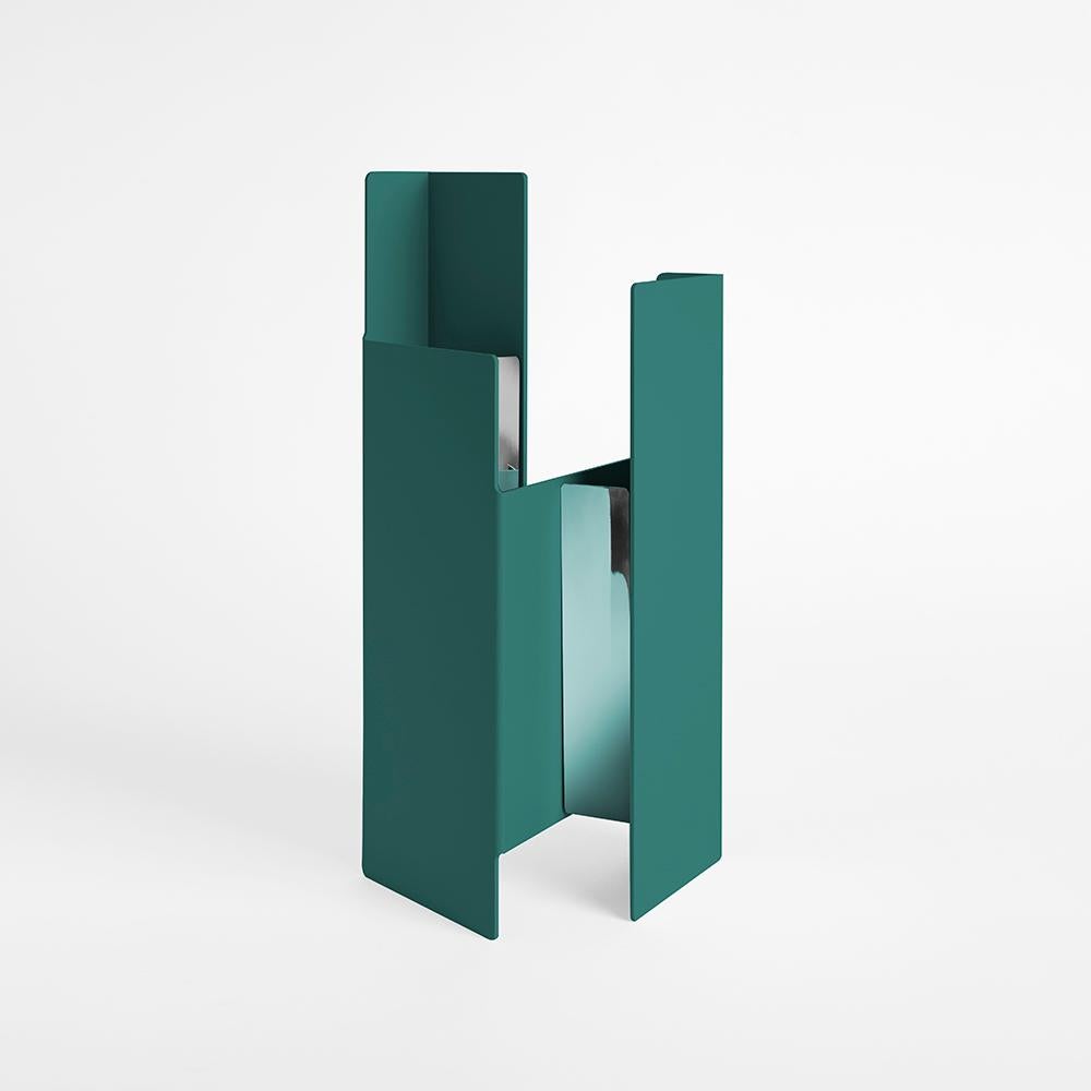 Petrol green fugit vase by Mason Editions
Design: Matteo Fiorini
Dimensions: 12 × 15 × 34 cm
Materials: Iron, Pirex glass

Fugit vase consists of a metal sheet that seems to turn and close around itself, generating an alternation of fullness