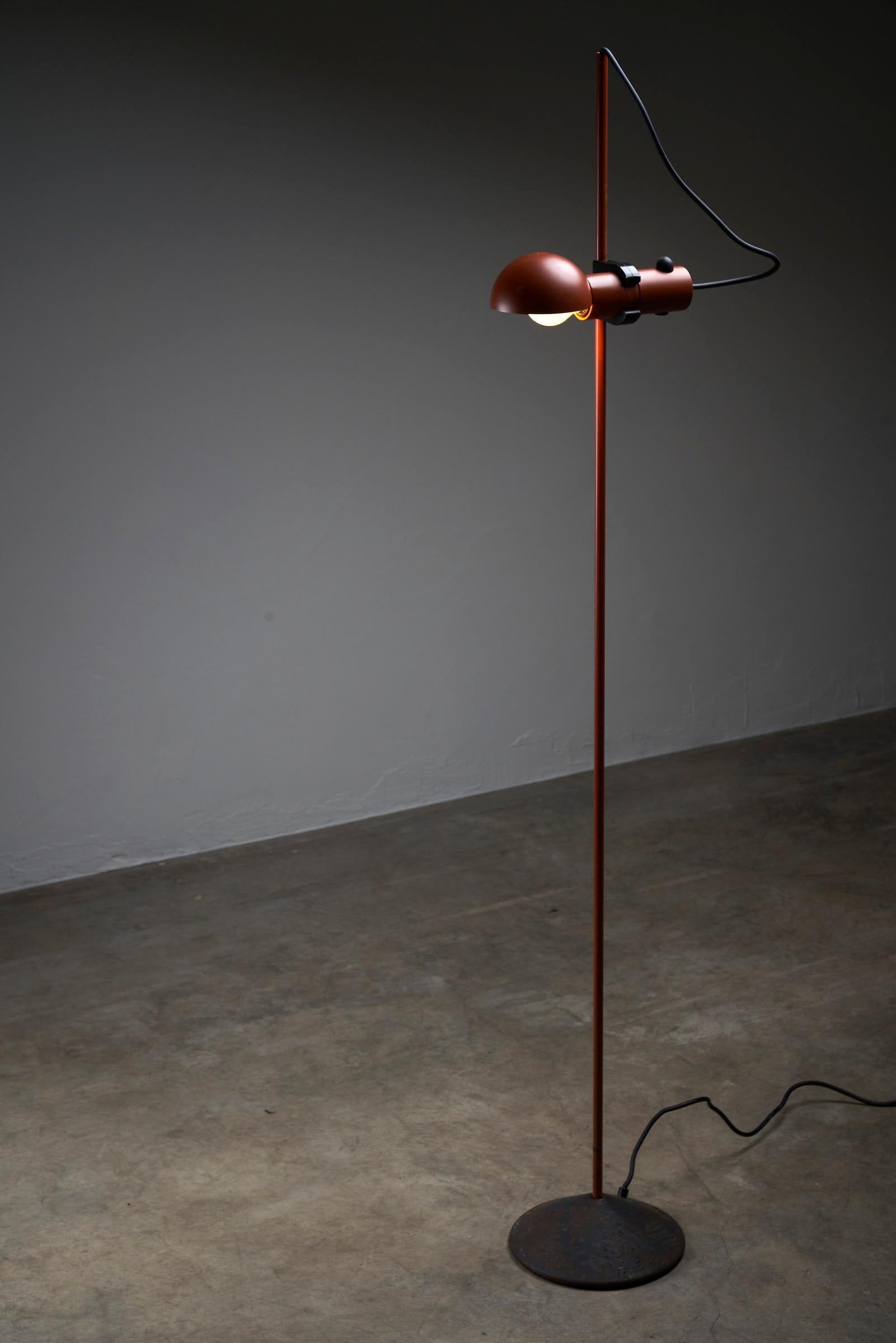 Introducing a remarkable floor lamp that seamlessly blends sleek design and functional brilliance, the Petrol Red Floor Lamp by Raul Barbieri & Giorgio Maranelli for Tronconi. This stunning lamp captures the essence of both form and functionality,