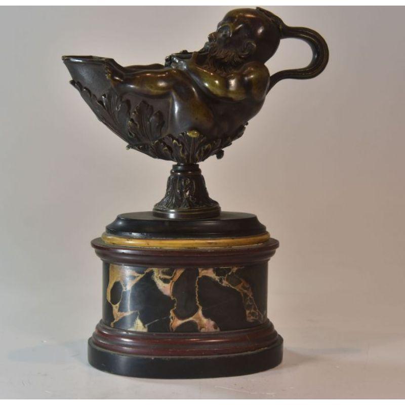 Astonishing bronze oil lamp decorated with a genie on portor marble base no signature XIXth century dimensions height 21 cm length 16 cm depth 8 cm

Additional information:
Material: bronze.