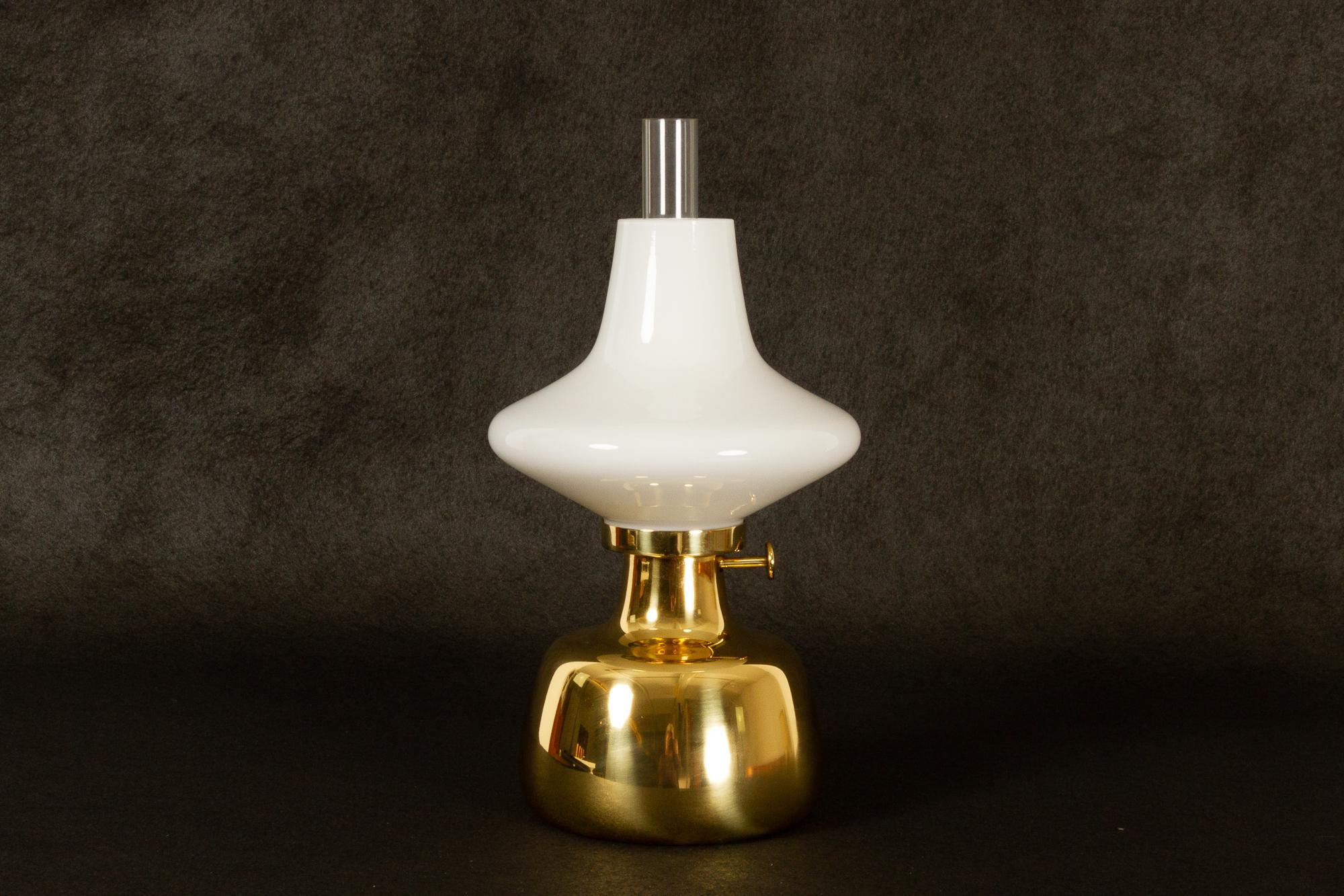 Petronella lamp by Henning Koppel for Louis Poulsen, 1960s.
Danish oil lamp in brass and white opaline glass. Designed by Danish designer Henning Koppel in 1961. The lamp body was handmade in 1993 by Louis Poulsen in Denmark. The glass parts were