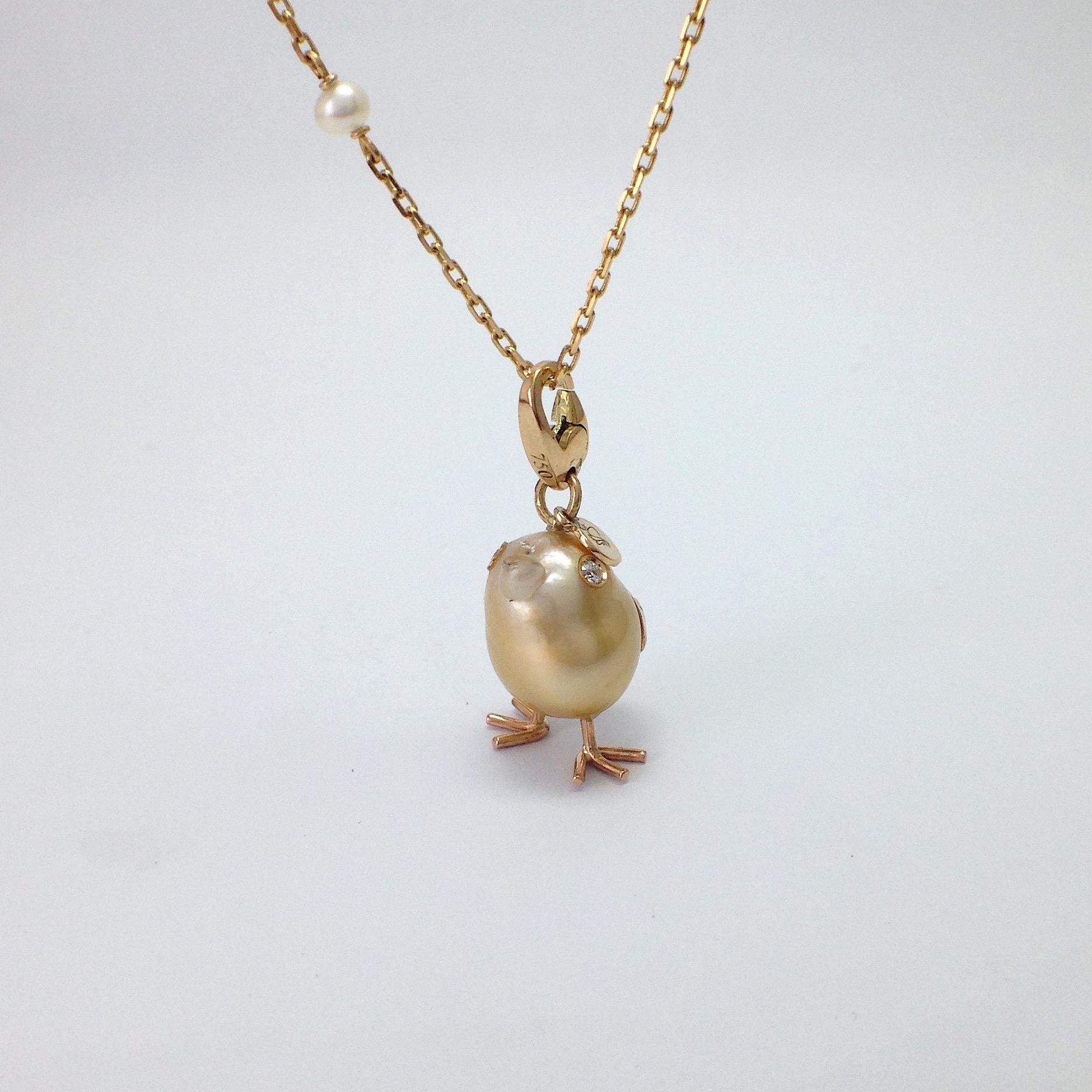 Chick Australian Pearl Diamond Yellow 18 Kt Gold Pendant or Necklace
An Australian pearl has been carefully crafted to make a chick. 
It has his two legs, two eyes encrusted with two white diamonds and his beak. 
The gold is yellow for all the