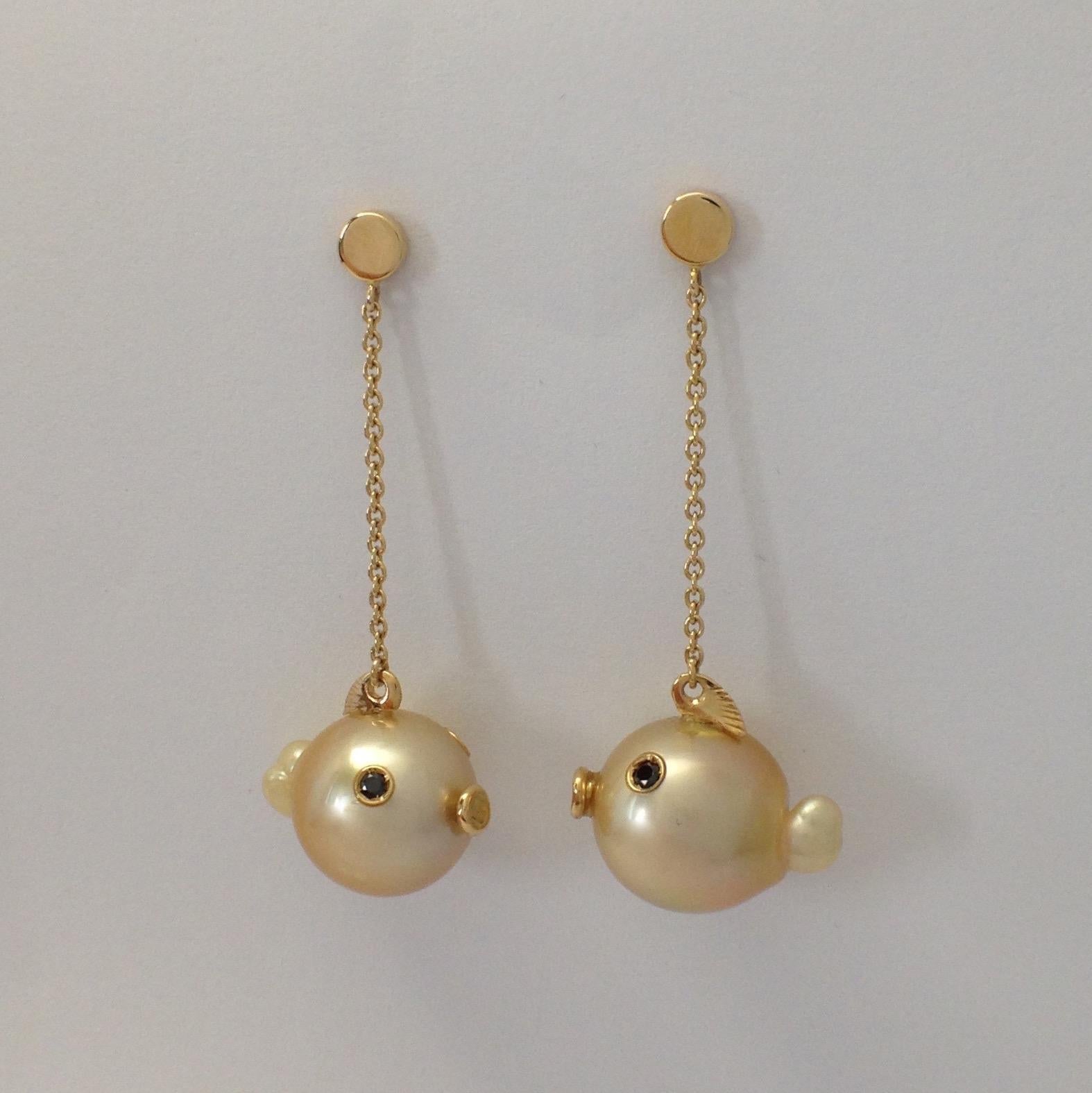 Fish Black Diamond Australian Pearl 18 Kt Gold Drop Dangle Earrings Made in Italy
On these earring there are two gold Australian pearls. 
I put two black diamonds for its eyes, a yellow gold fin.
They are totally handmade.
The diamonds are a total