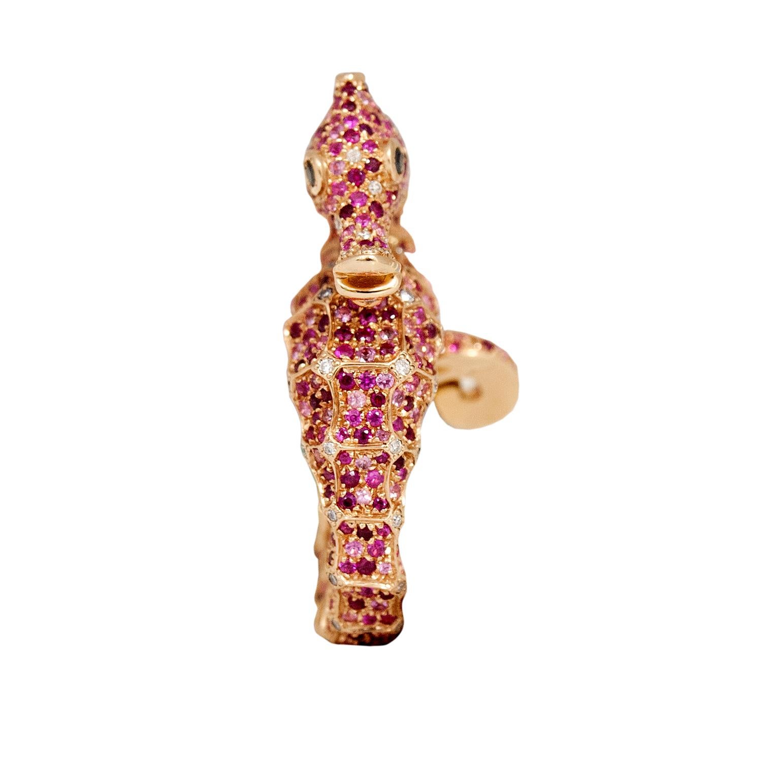 Petronilla Hippocampus Sea Horse Diamond Pink Sapphire Ruby 18Kt Gold Ring made in Italy
This is a statuesque ring, elegant and harmonious in its volume and size. It's entirely covered by many precious stones such as black and white diamonds, pink