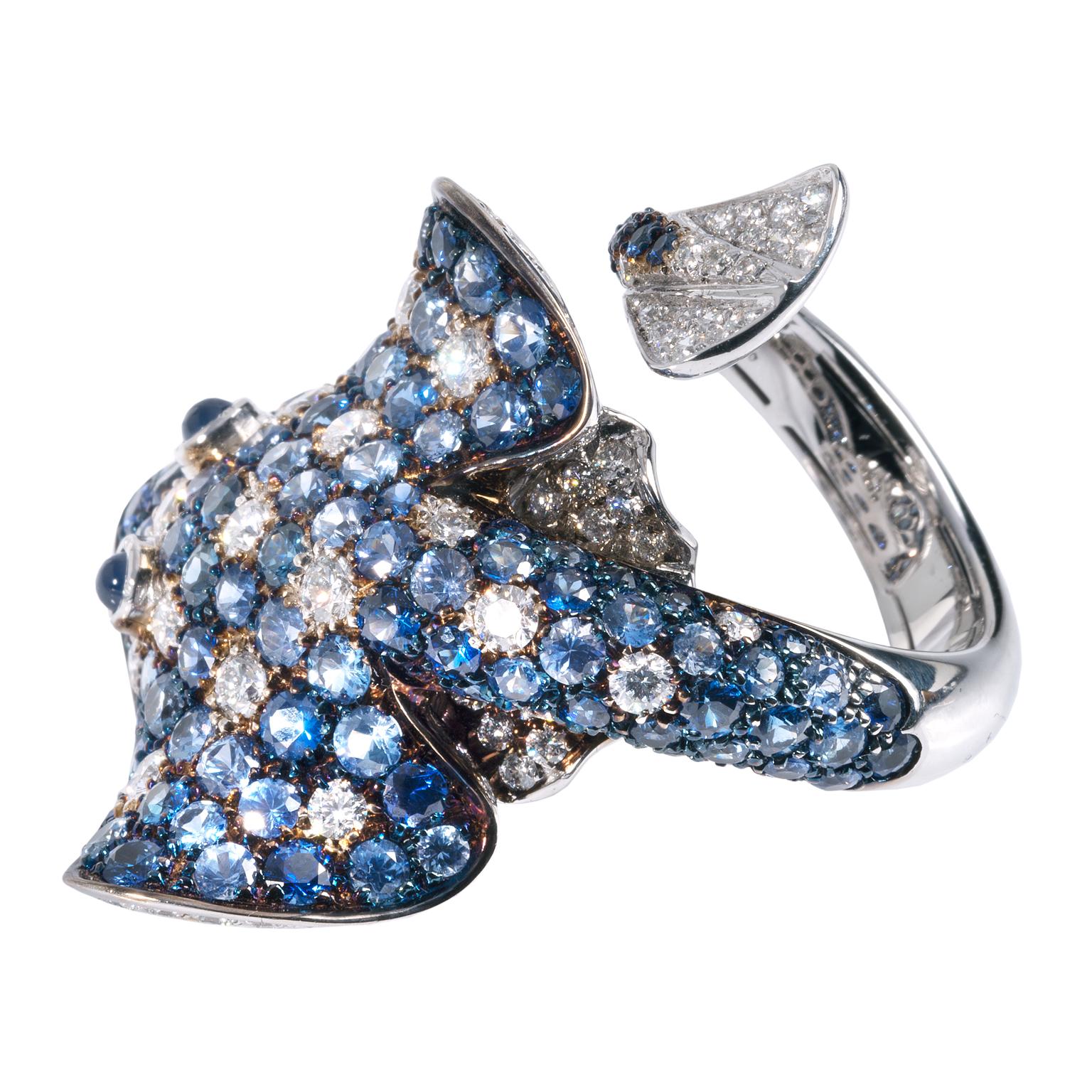 Ray Fish White Diamond Blue Sapphire 18 Karat Gold Ring Made in Italy 
I drew inspiration from the Spotted Eagle Ray which is found in tropical waters and its distinguished by its spotted and ringed back. I created the ring in my workshop near