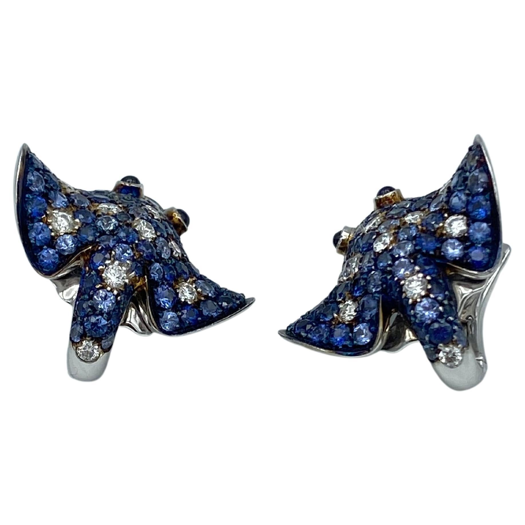 Ray Fish White Diamond Blue Sapphire 18Kt Gold Earrings Made in Italy
These earrings are handcrafted in my workshop in Verona, Northern Italy. 
They are covered with diamonds and blue sapphires in three different shades and their eyes are two blue