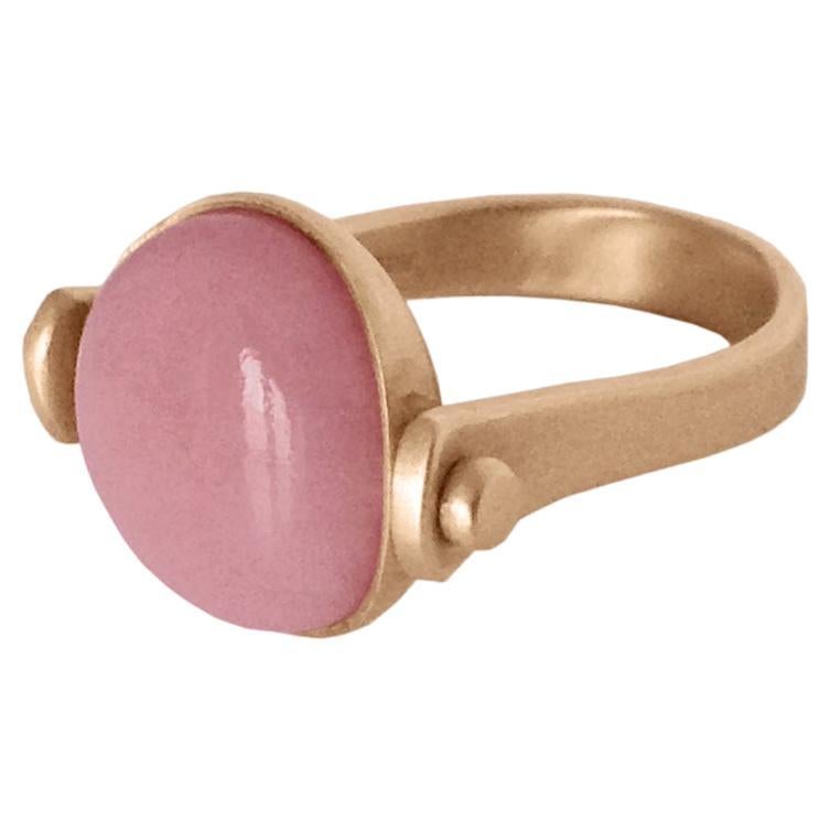 Roman Style Pink Opal 18Kt Gold Reversible Ring Made in Italy
This ring was inspired by ancient Roman jewelry. They used to wear a ring where its head would be round. There's a pink round opal as a button above and if you turn it you'll see only